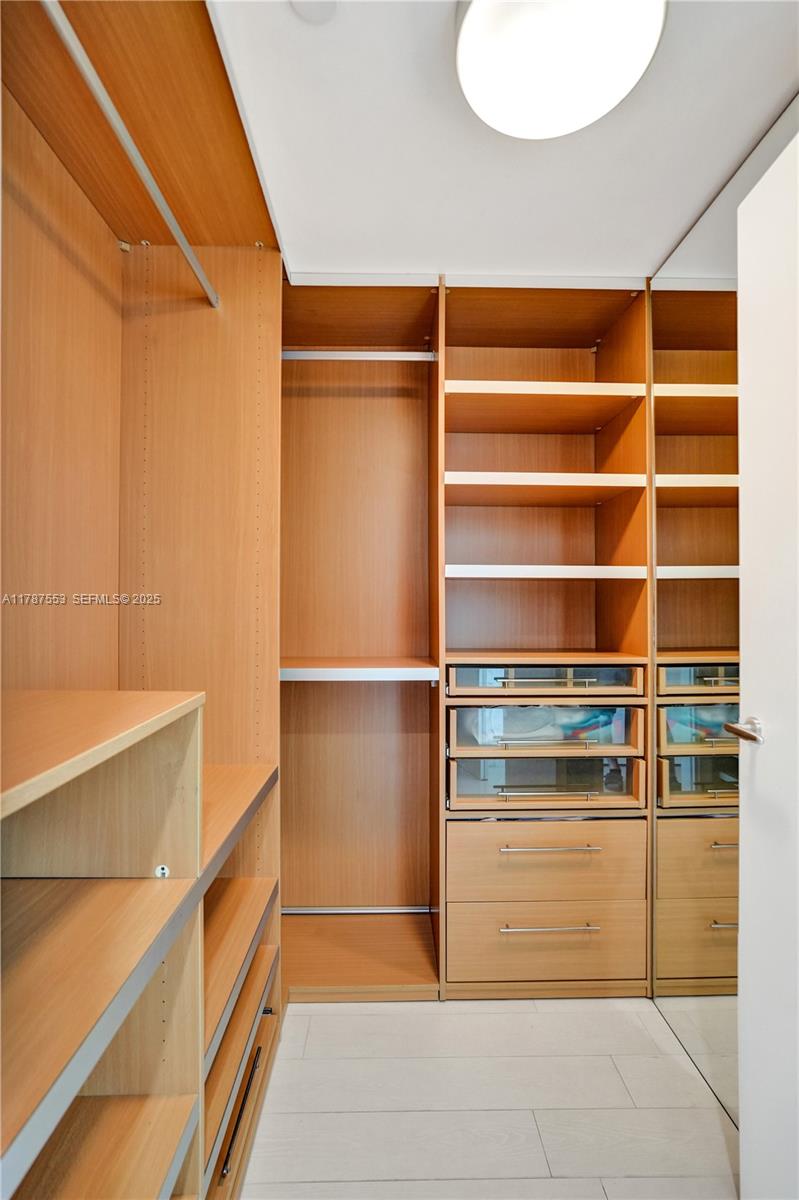 200 Biscayne Blvd Way, Unit 3211 Miami, FL 33131 - Photo 14 of 27 a view of walk in closet with empty racks