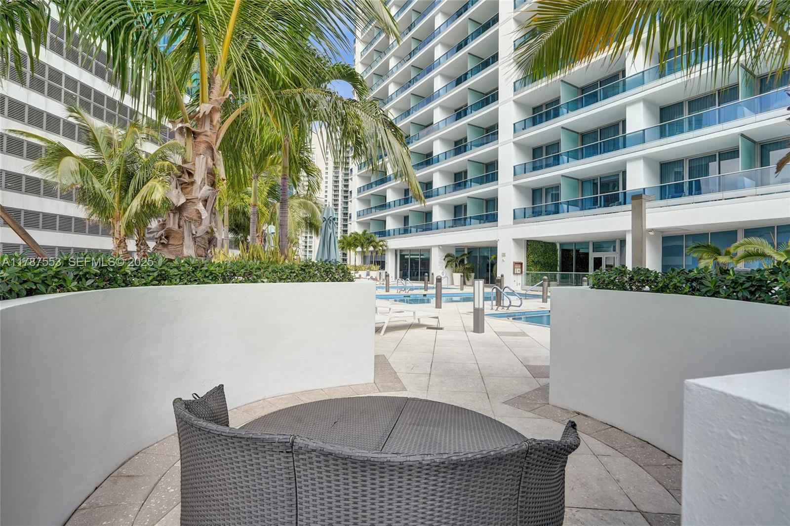 200 Biscayne Blvd Way, Unit 3211 Miami, FL 33131 - Photo 21 of 27 a view of house with swimming pool and sitting area