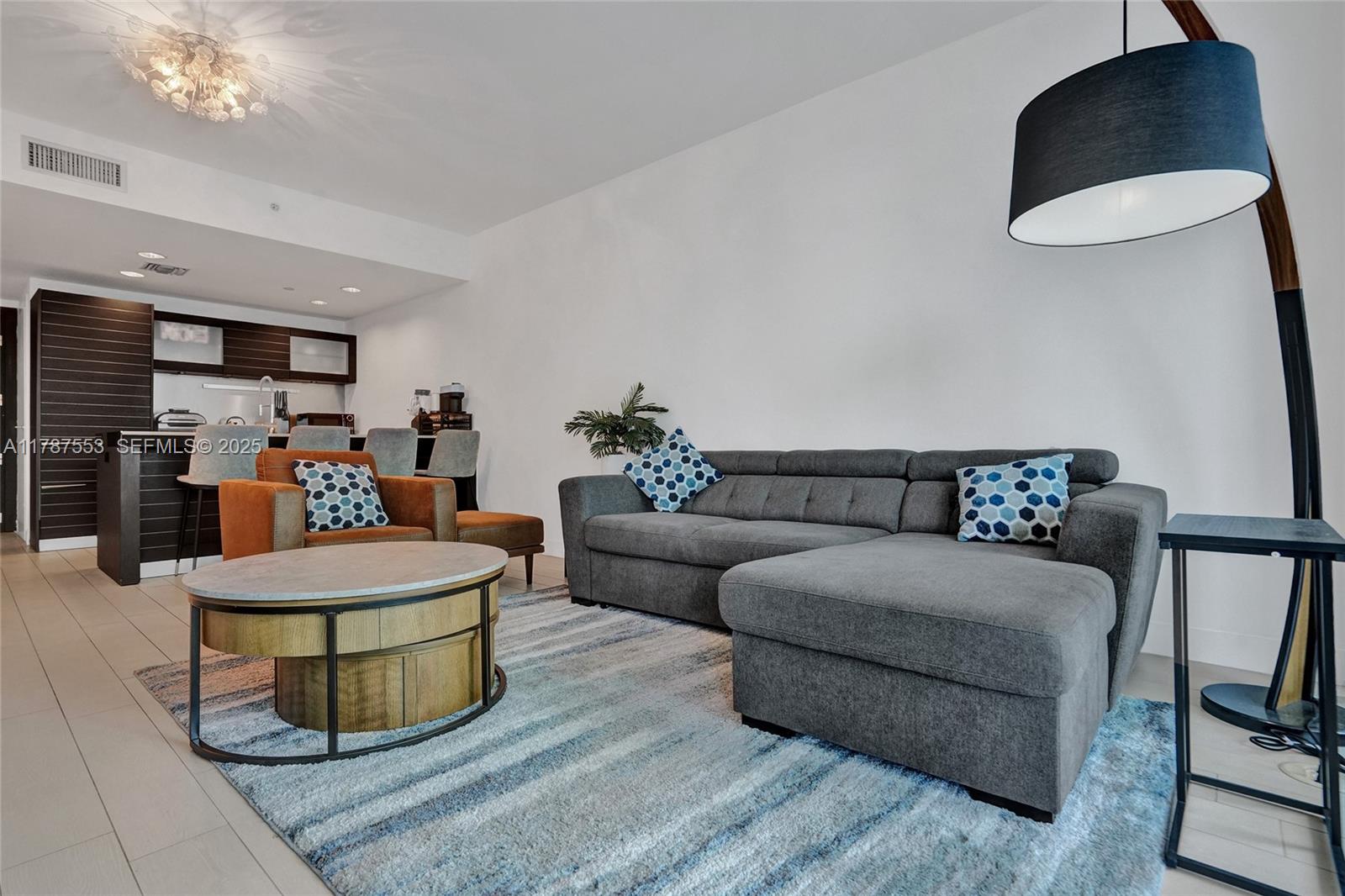 200 Biscayne Blvd Way, Unit 3211 Miami, FL 33131 - Photo 4 of 27 a living room with furniture and a wooden floor