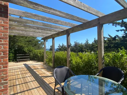 a view of a porch with furniture and yard