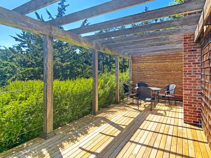 a view of a patio with table and chairs in the patio
