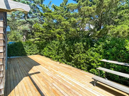 a view of balcony with wooden floor