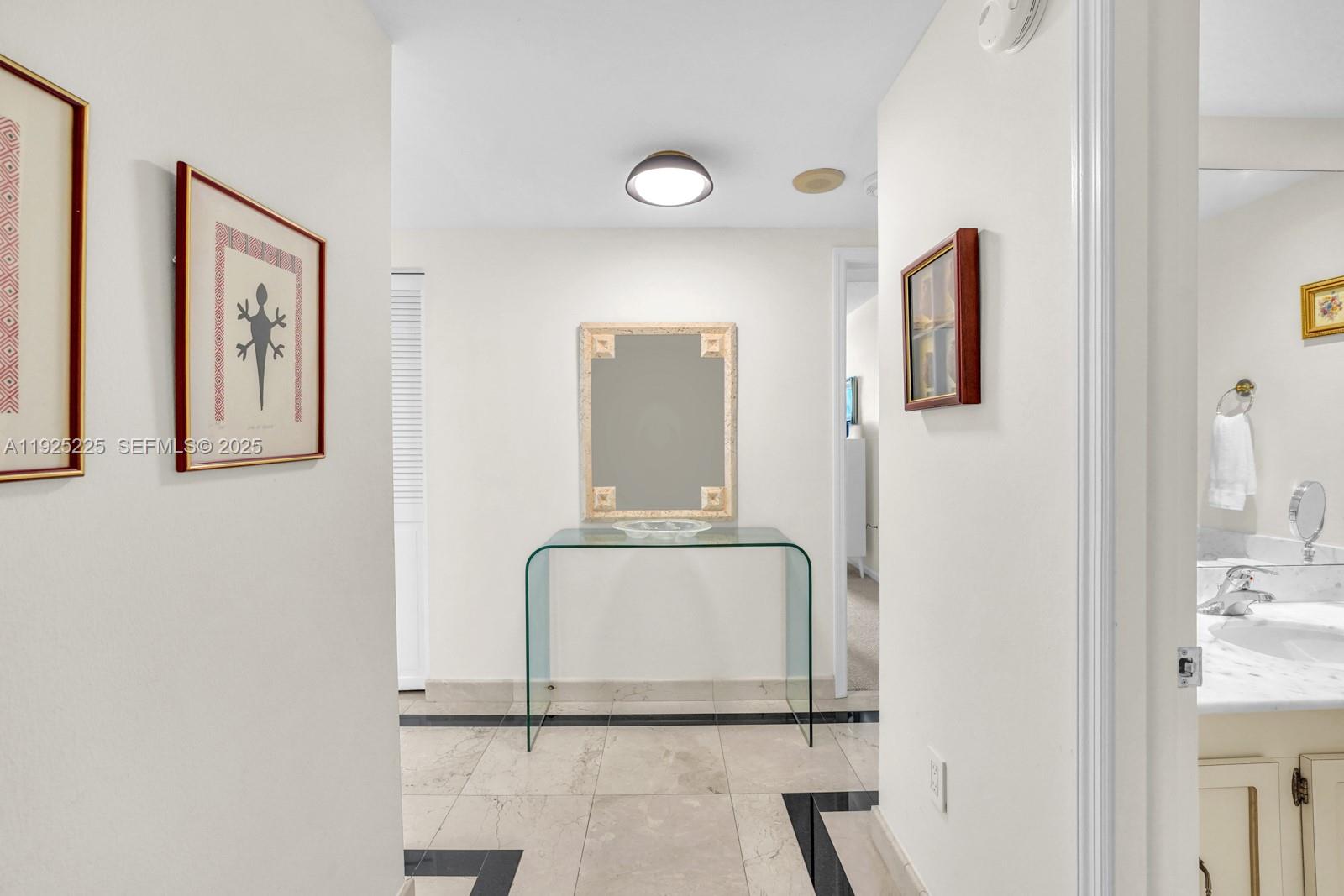 Key Biscayne Key Biscayne, FL 33149 - Photo 12 of 21 a bathroom with a sink and mirror