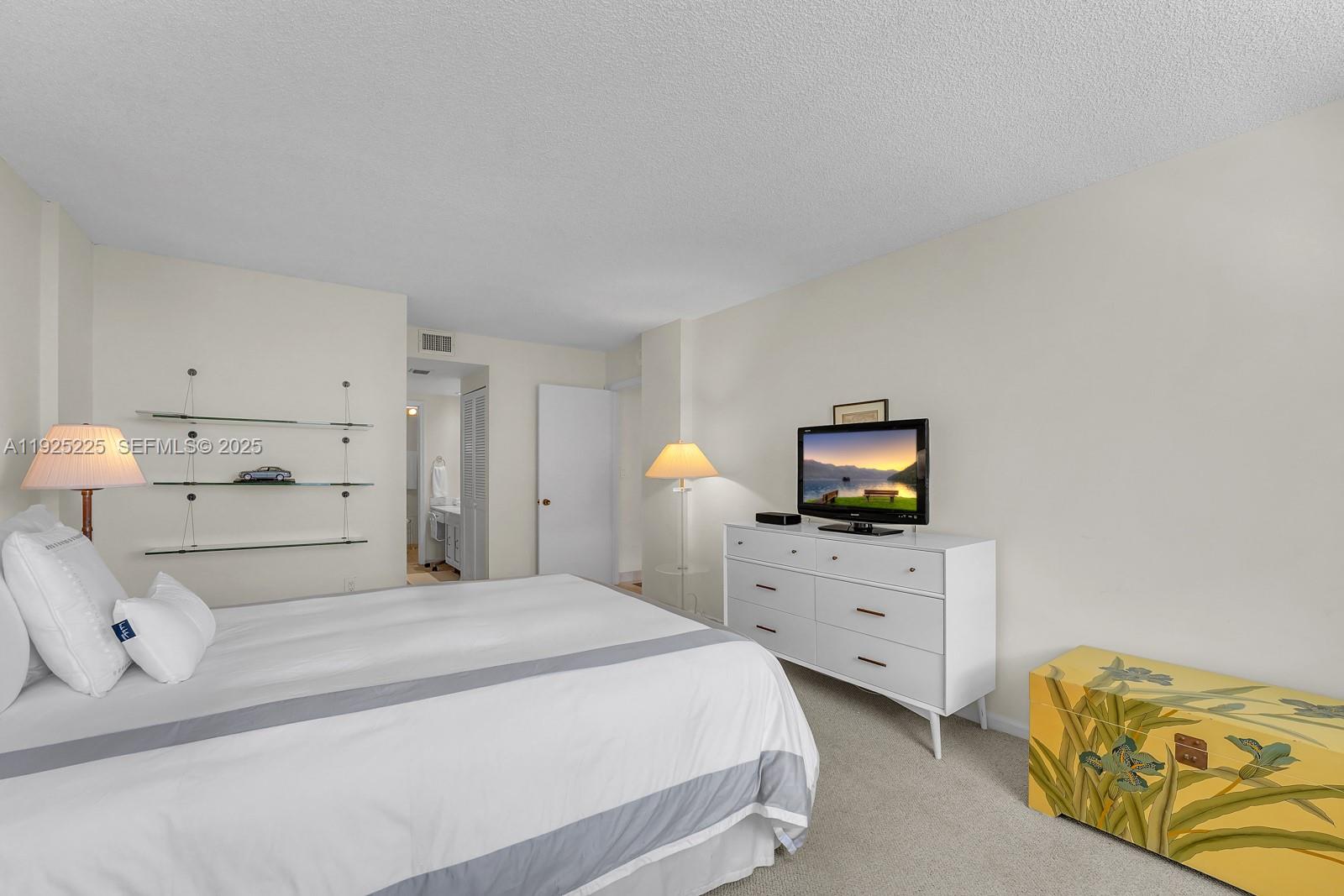 Key Biscayne Key Biscayne, FL 33149 - Photo 13 of 21 a bedroom with a bed and window