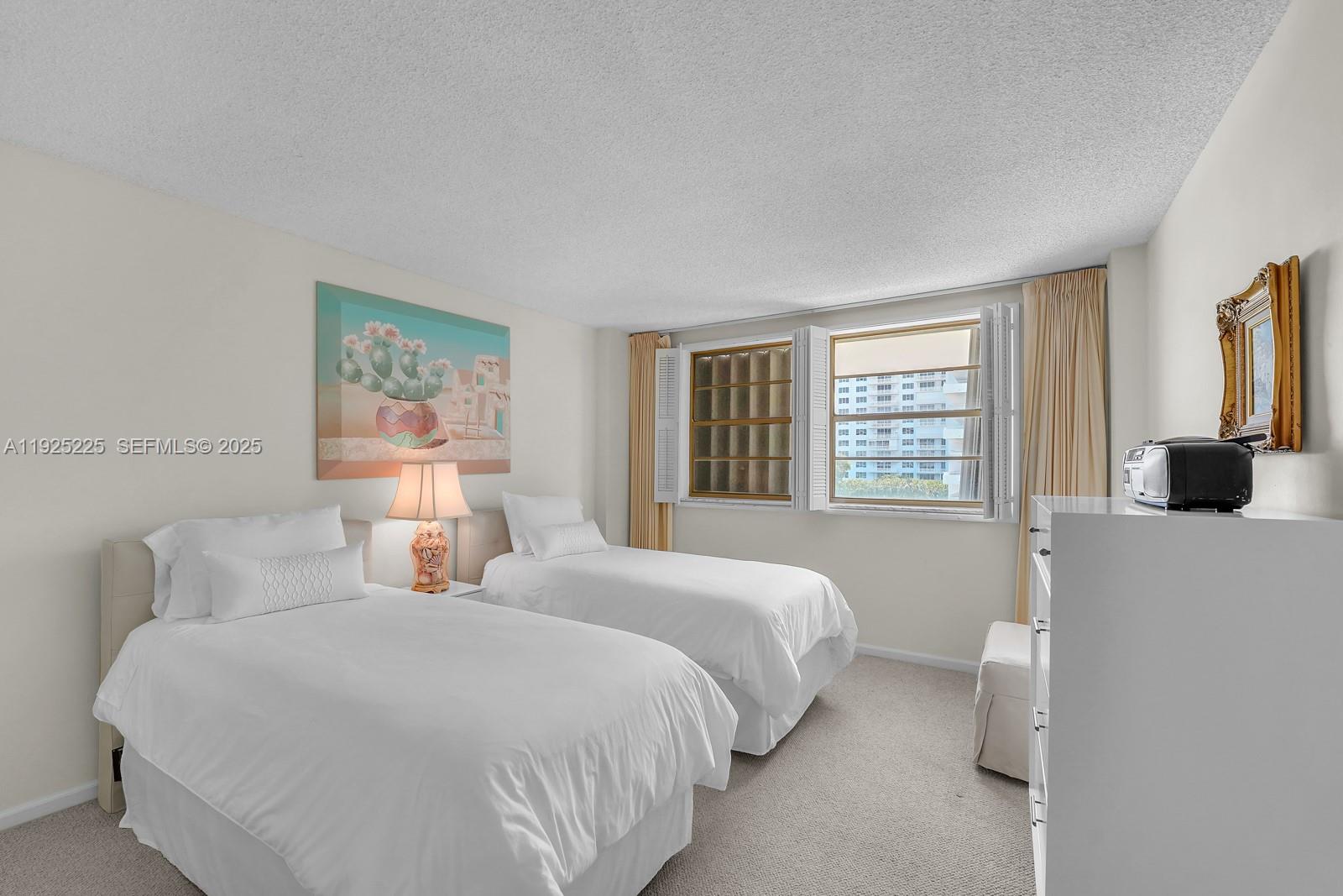 Key Biscayne Key Biscayne, FL 33149 - Photo 16 of 21 a bedroom with bed and a window