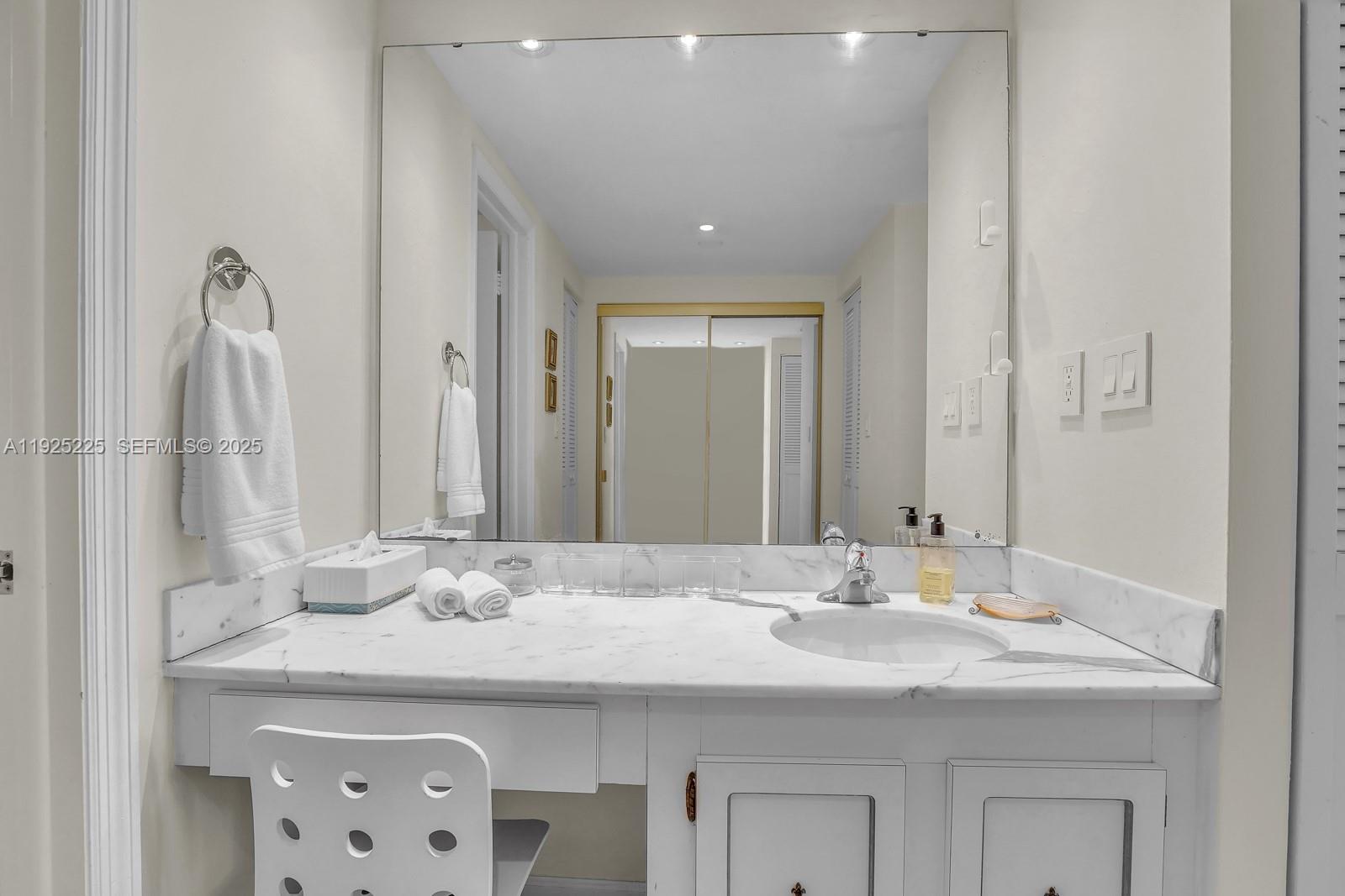 Key Biscayne Key Biscayne, FL 33149 - Photo 18 of 21 a bathroom with a granite countertop sink and a mirror