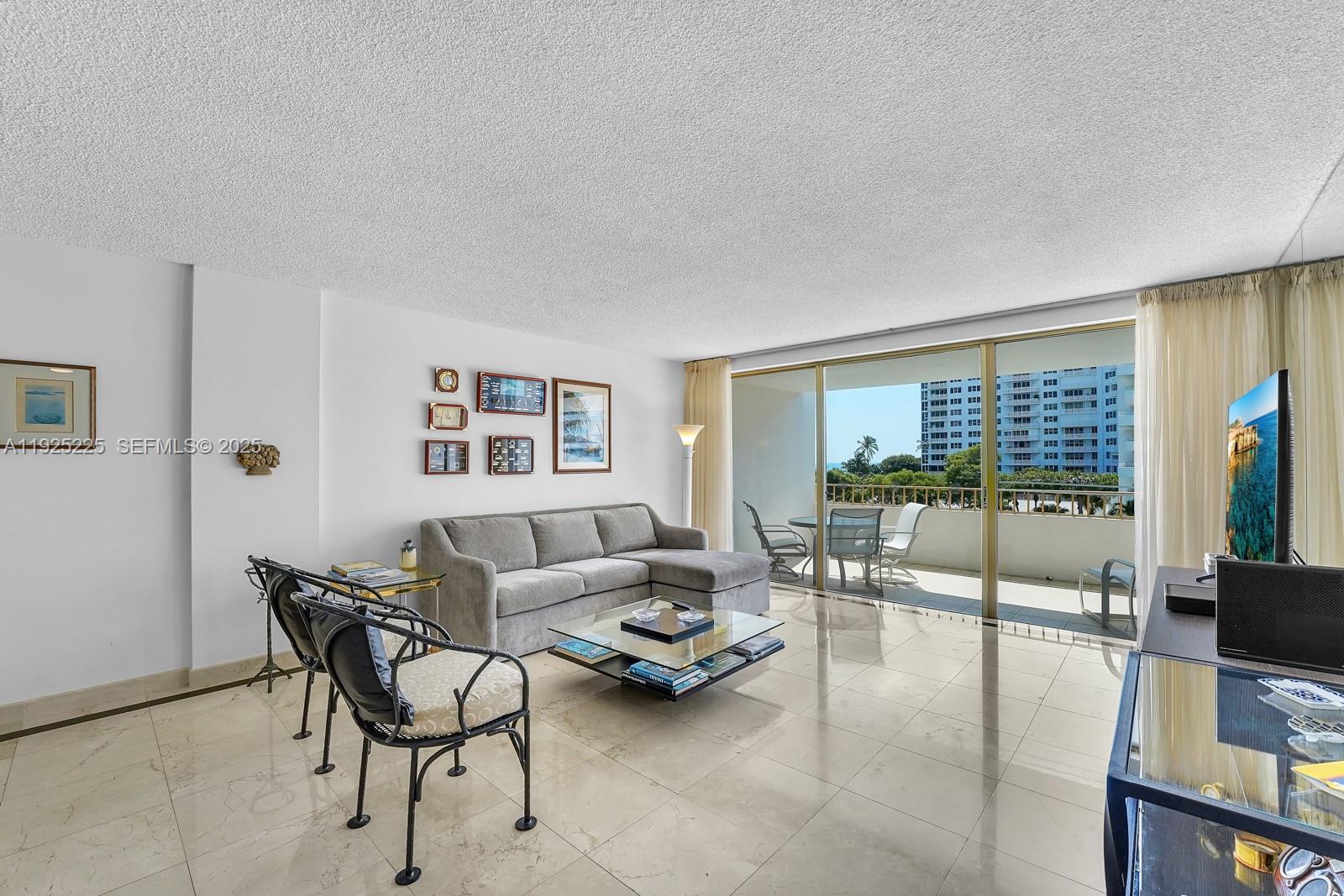 Key Biscayne Key Biscayne, FL 33149 - Photo 3 of 21 a living room with furniture and a floor to ceiling window