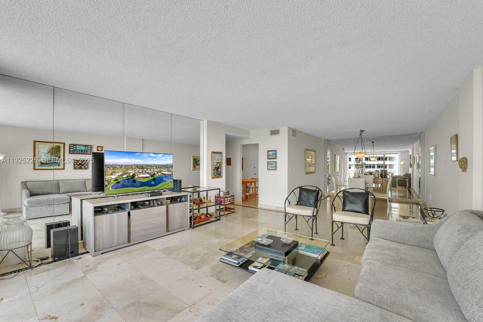 Key Biscayne Key Biscayne, FL 33149 - Photo 5 of 21 a living room with furniture and a flat screen tv
