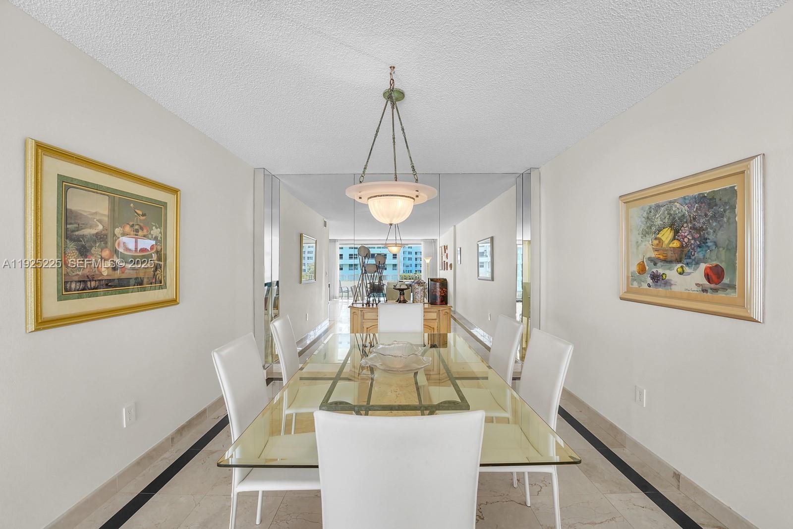 Key Biscayne Key Biscayne, FL 33149 - Photo 6 of 21 a view of a dining room with furniture wooden floor and a chandelier