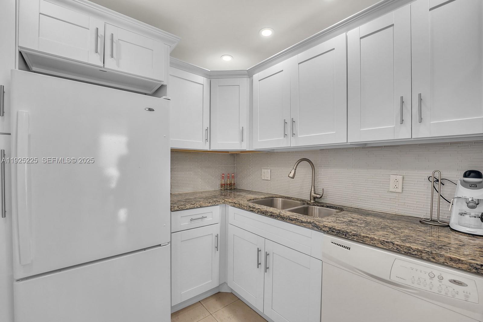 Key Biscayne Key Biscayne, FL 33149 - Photo 9 of 21 a kitchen with appliances cabinets and a counter top space