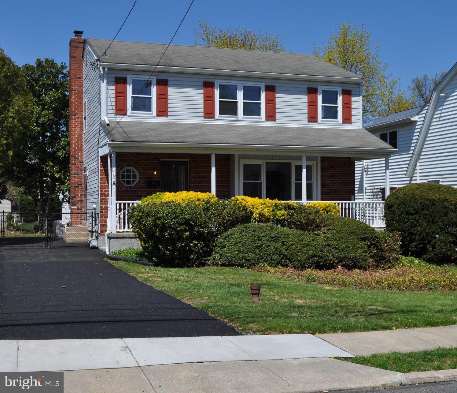 158 South Highland Road Springfield, PA 19064 - Photo 1 of 46 a front view of a house with a yard and garage