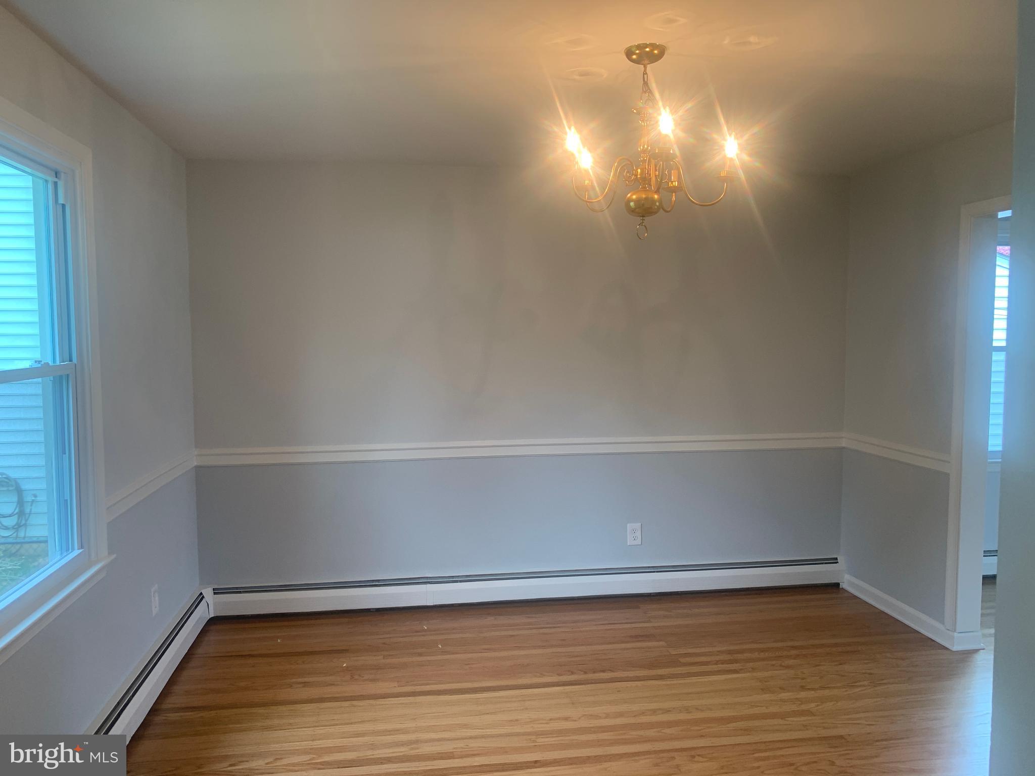 158 South Highland Road Springfield, PA 19064 - Photo 11 of 46 a view of an empty room with wooden floor and a window