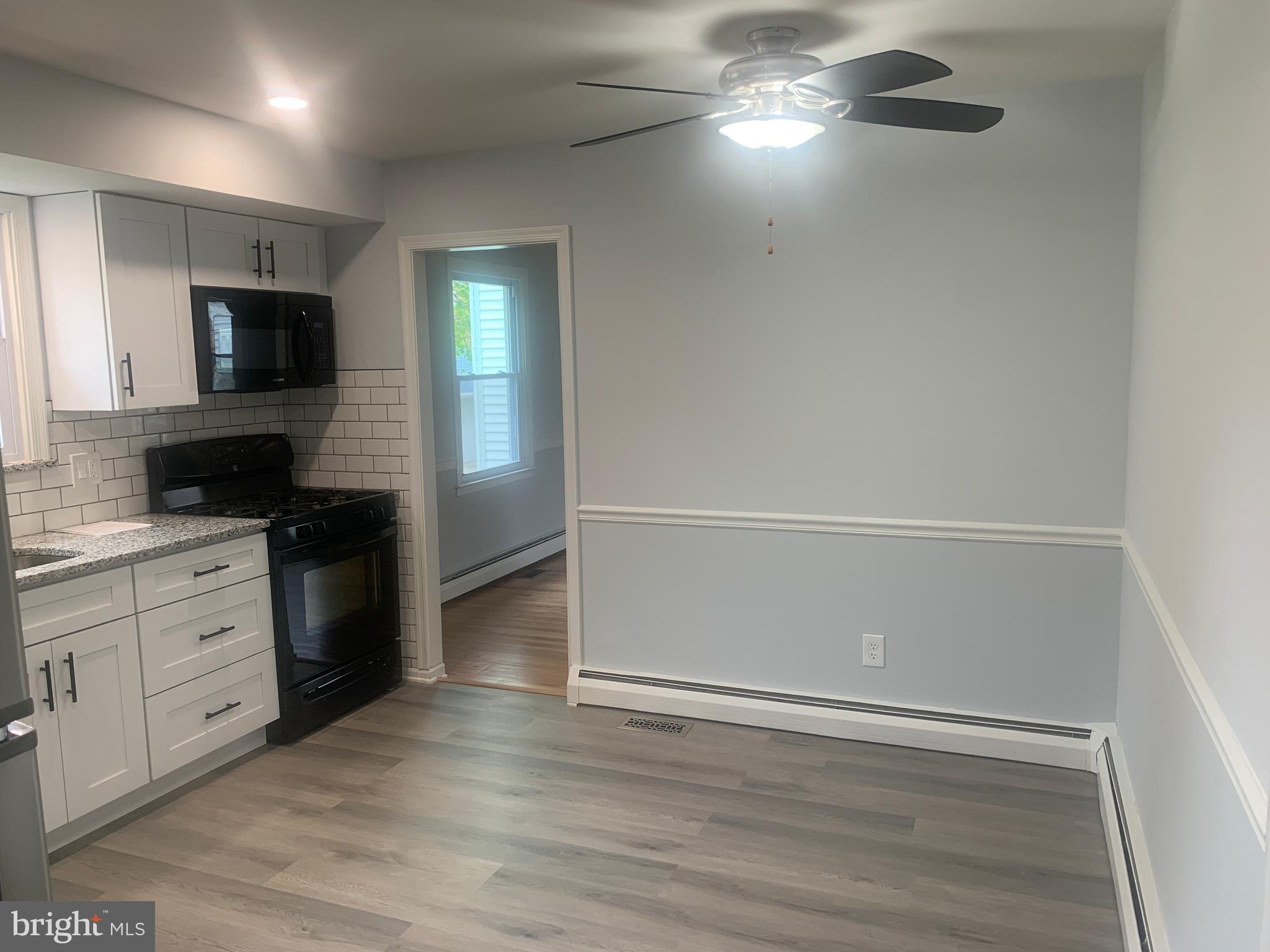 158 South Highland Road Springfield, PA 19064 - Photo 14 of 46 a kitchen with a refrigerator and a stove top oven