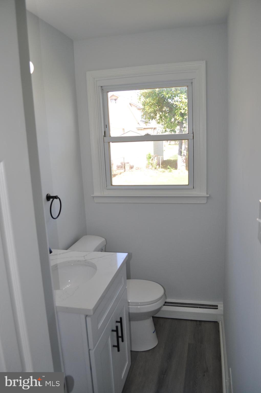158 South Highland Road Springfield, PA 19064 - Photo 16 of 46 a bathroom with a sink toilet and window