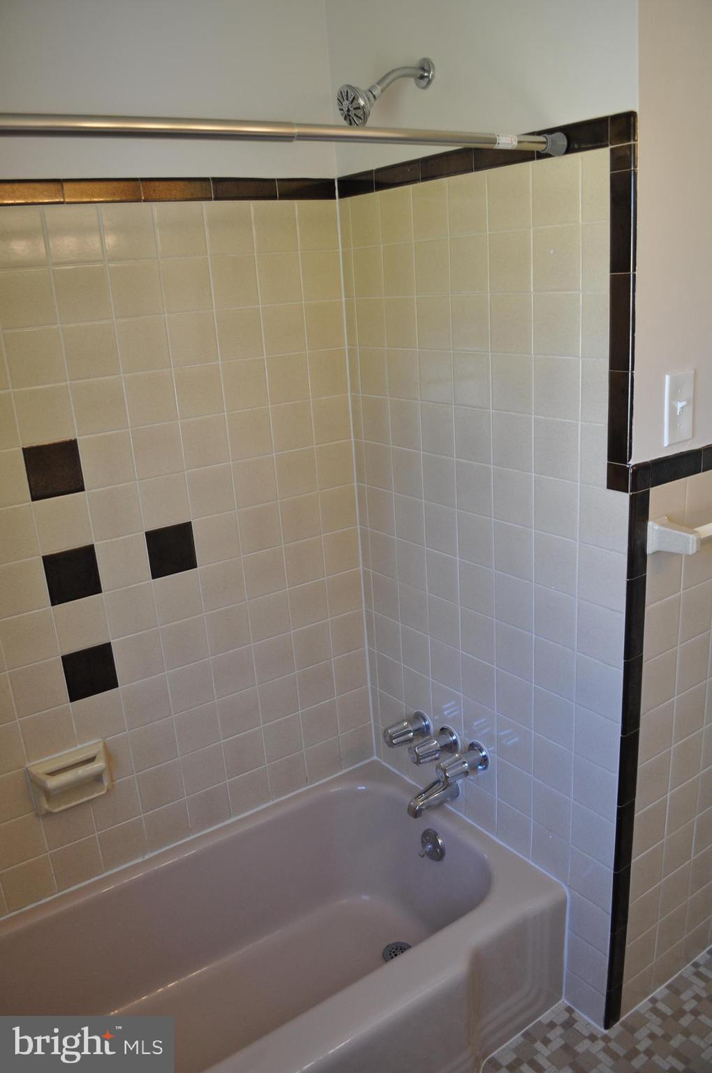158 South Highland Road Springfield, PA 19064 - Photo 29 of 46 a bathroom with a bathtub and shower