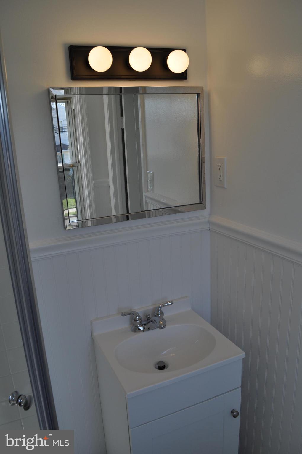 158 South Highland Road Springfield, PA 19064 - Photo 33 of 46 a bathroom with a sink and a mirror