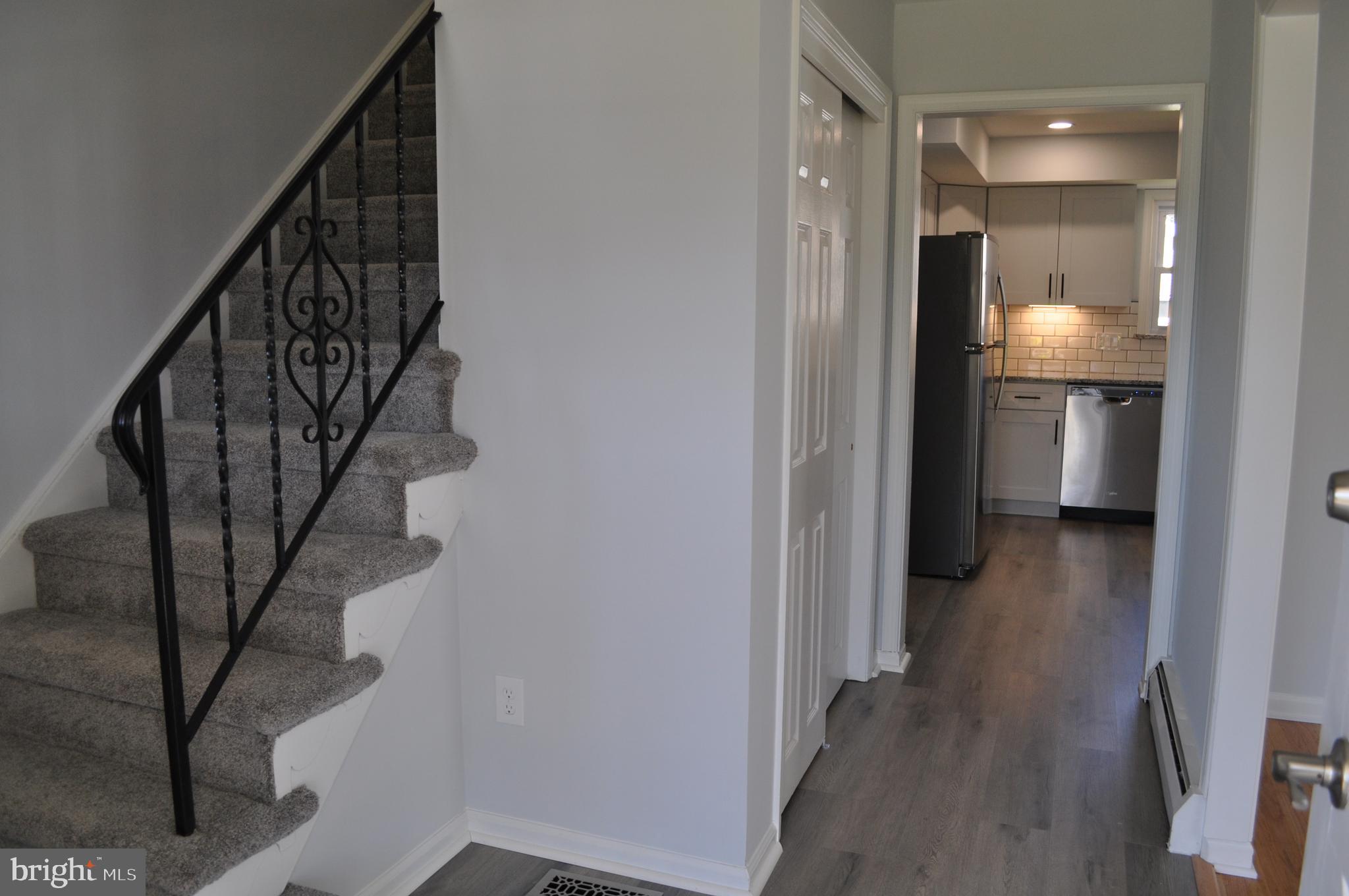 158 South Highland Road Springfield, PA 19064 - Photo 5 of 46 a view of a hallway with wooden floor and entryway