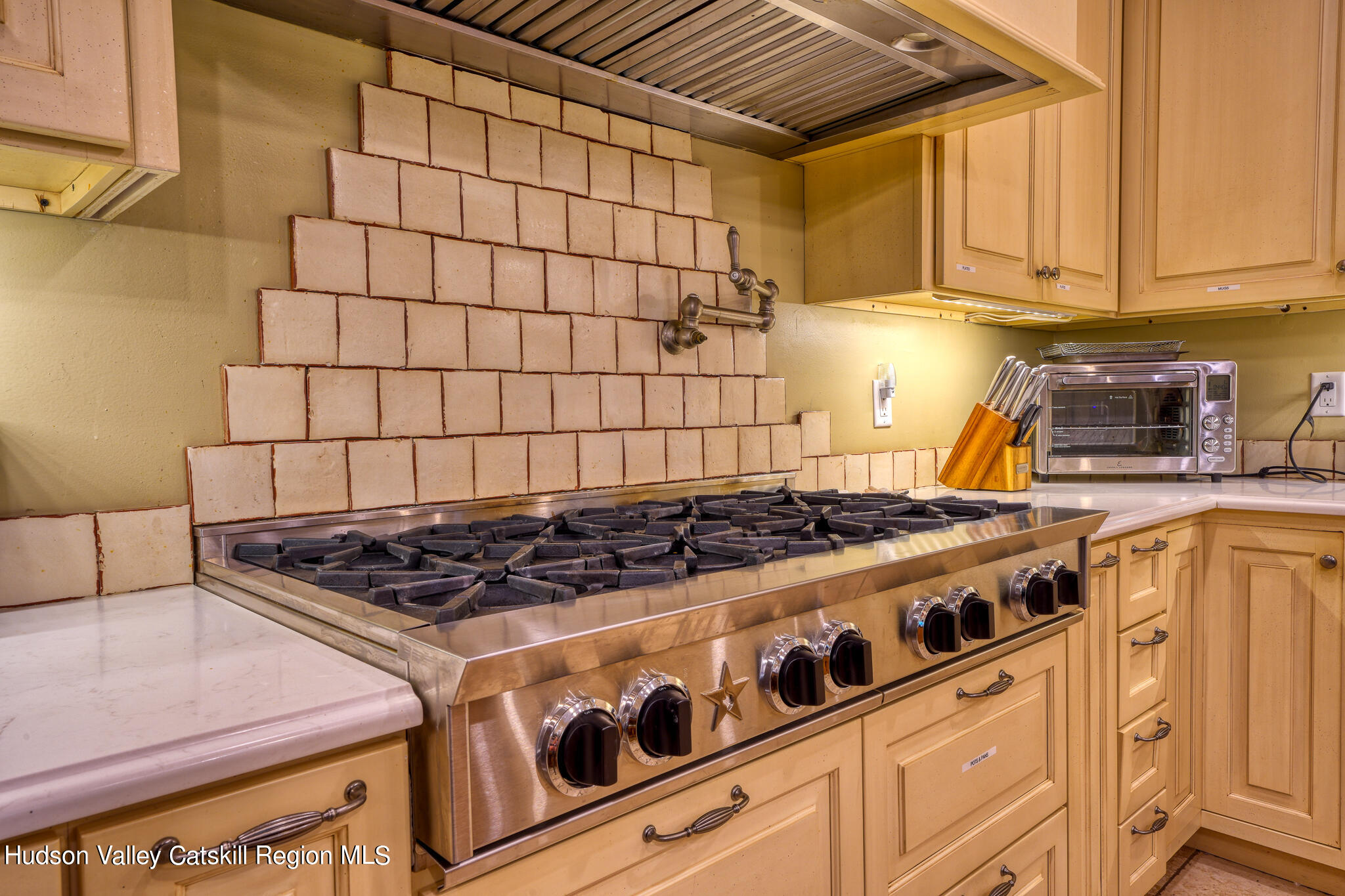 103 Carney Road Ulster Park, NY 12487 - Photo 17 of 89 a stove top oven sitting inside of a kitchen