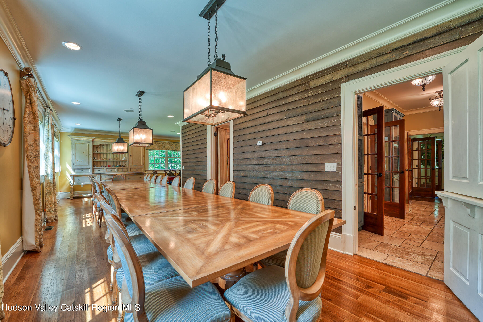 103 Carney Road Ulster Park, NY 12487 - Photo 20 of 89 a dining room with furniture a chandelier and wooden floor