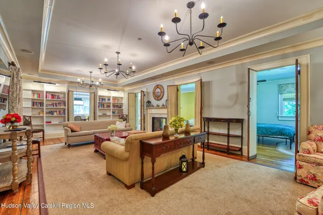 a room with pool table and a chandelier