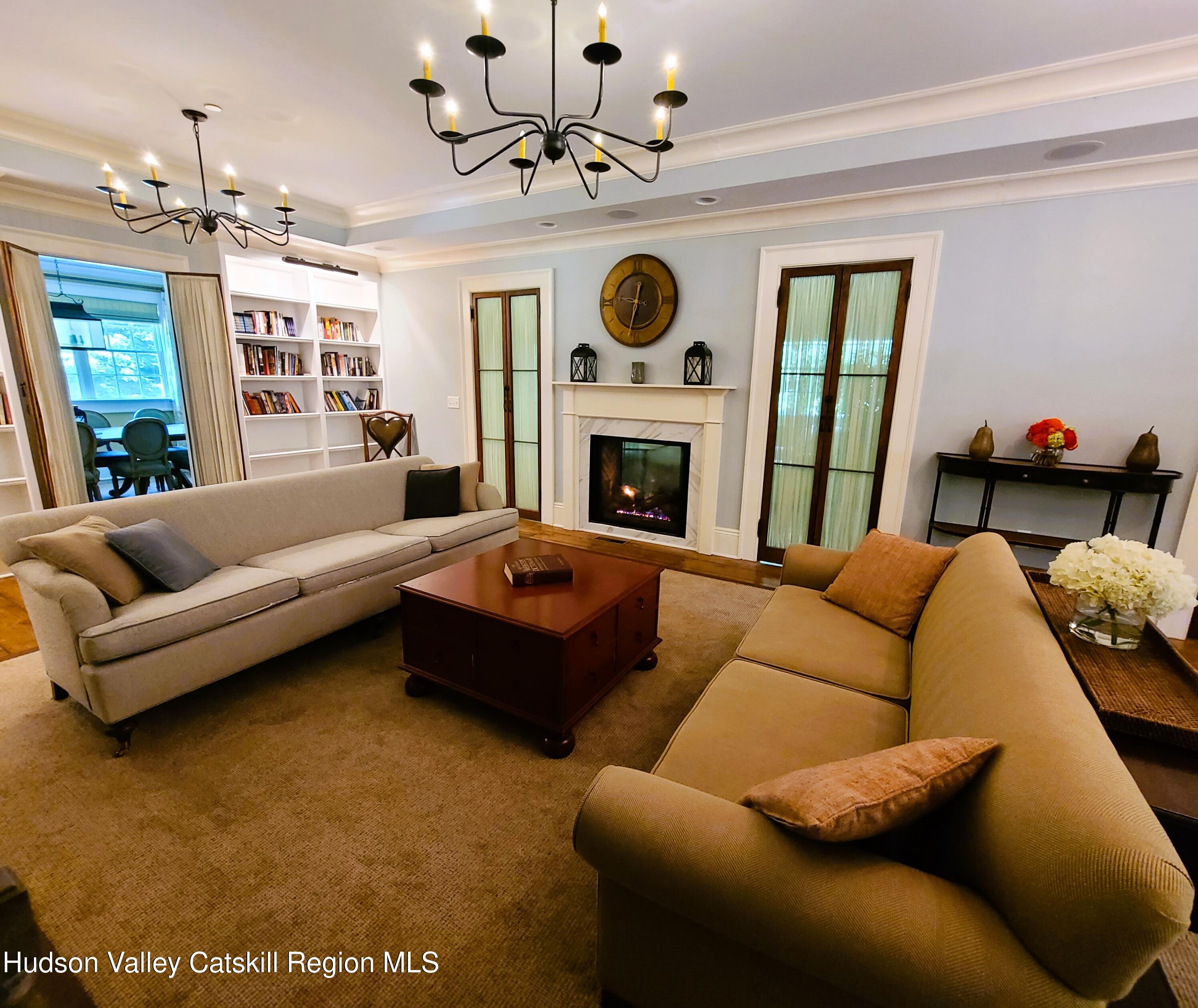 103 Carney Road Ulster Park, NY 12487 - Photo 25 of 89 a living room with furniture and a fireplace