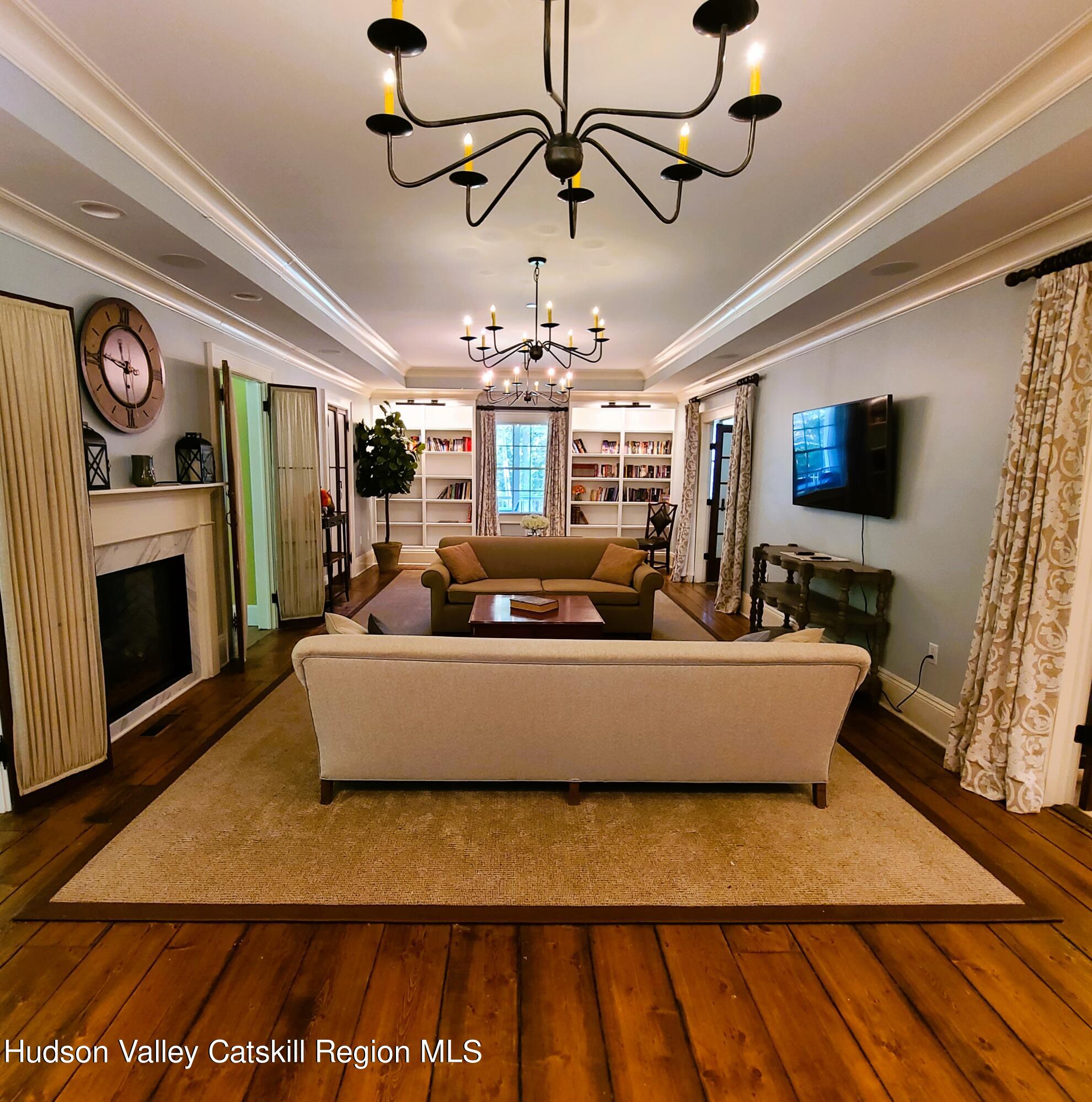 103 Carney Road Ulster Park, NY 12487 - Photo 27 of 89 a living room with furniture and a fireplace