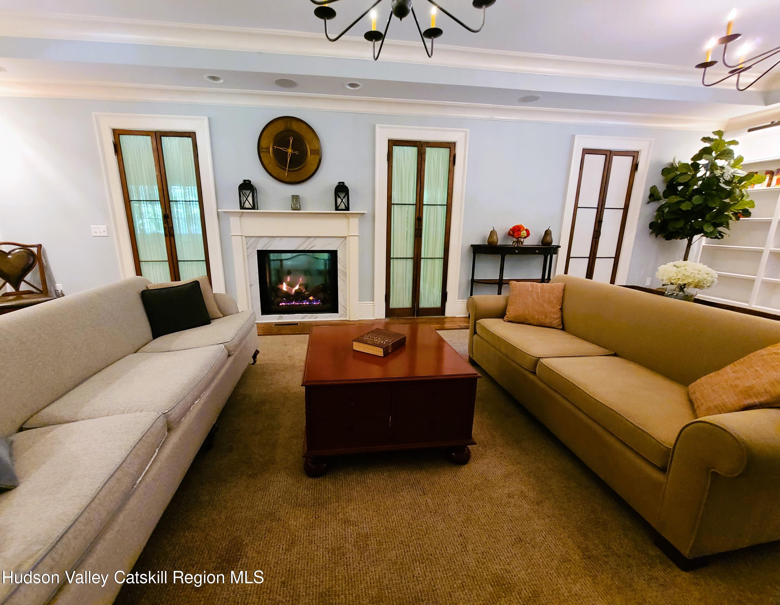 103 Carney Road Ulster Park, NY 12487 - Photo 28 of 89 a living room with furniture and a fireplace