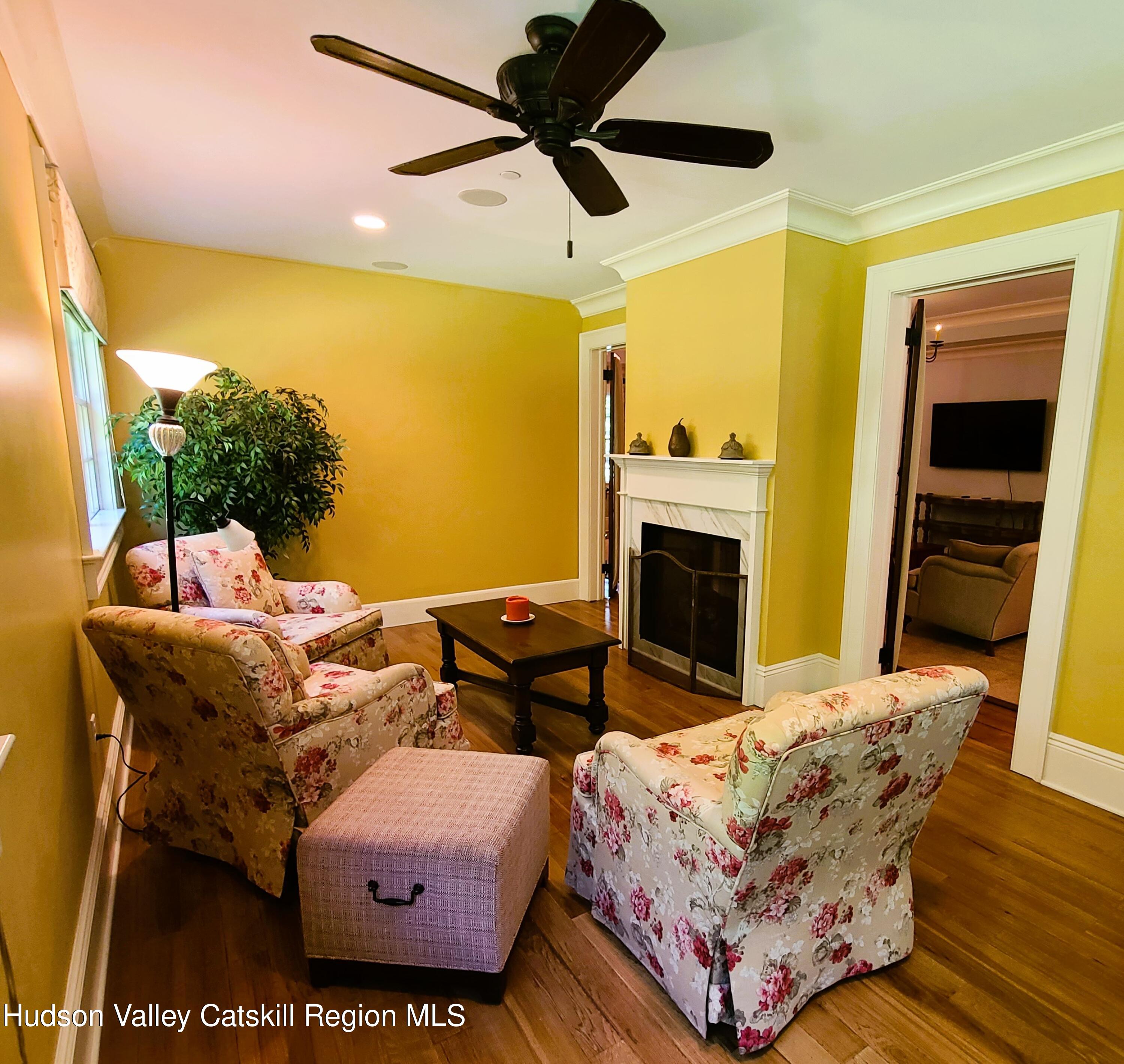 103 Carney Road Ulster Park, NY 12487 - Photo 32 of 89 a living room with furniture and a fireplace