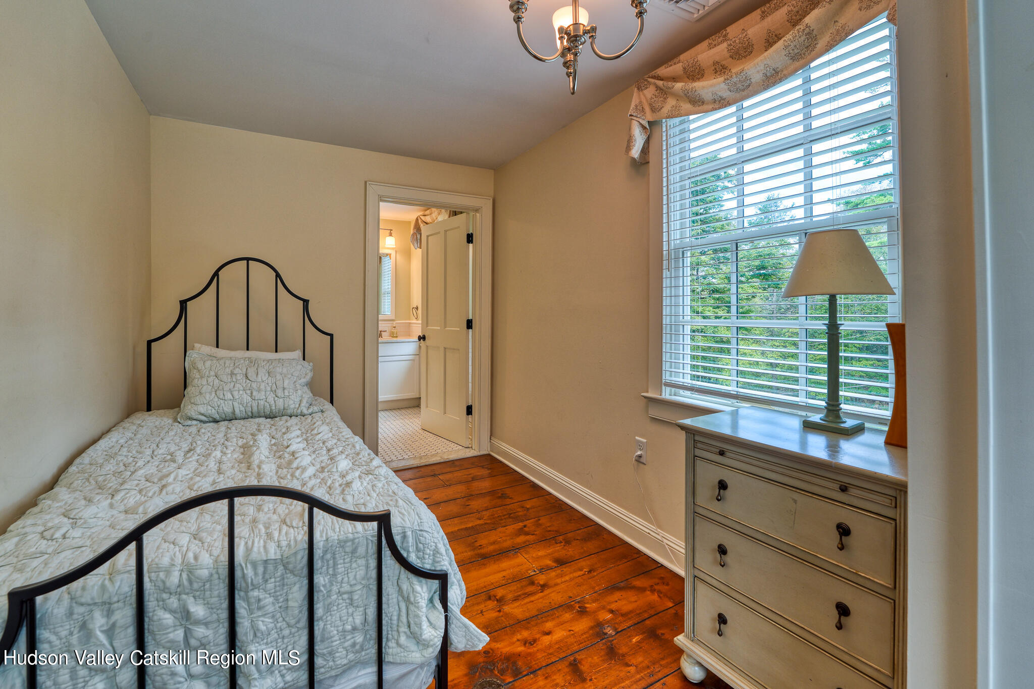 103 Carney Road Ulster Park, NY 12487 - Photo 39 of 89 a view of a bedroom with a bed and wooden floor