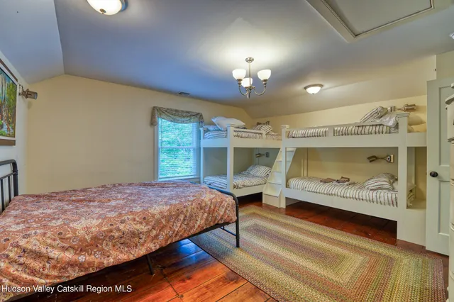 a living room with furniture a rug and a chandelier