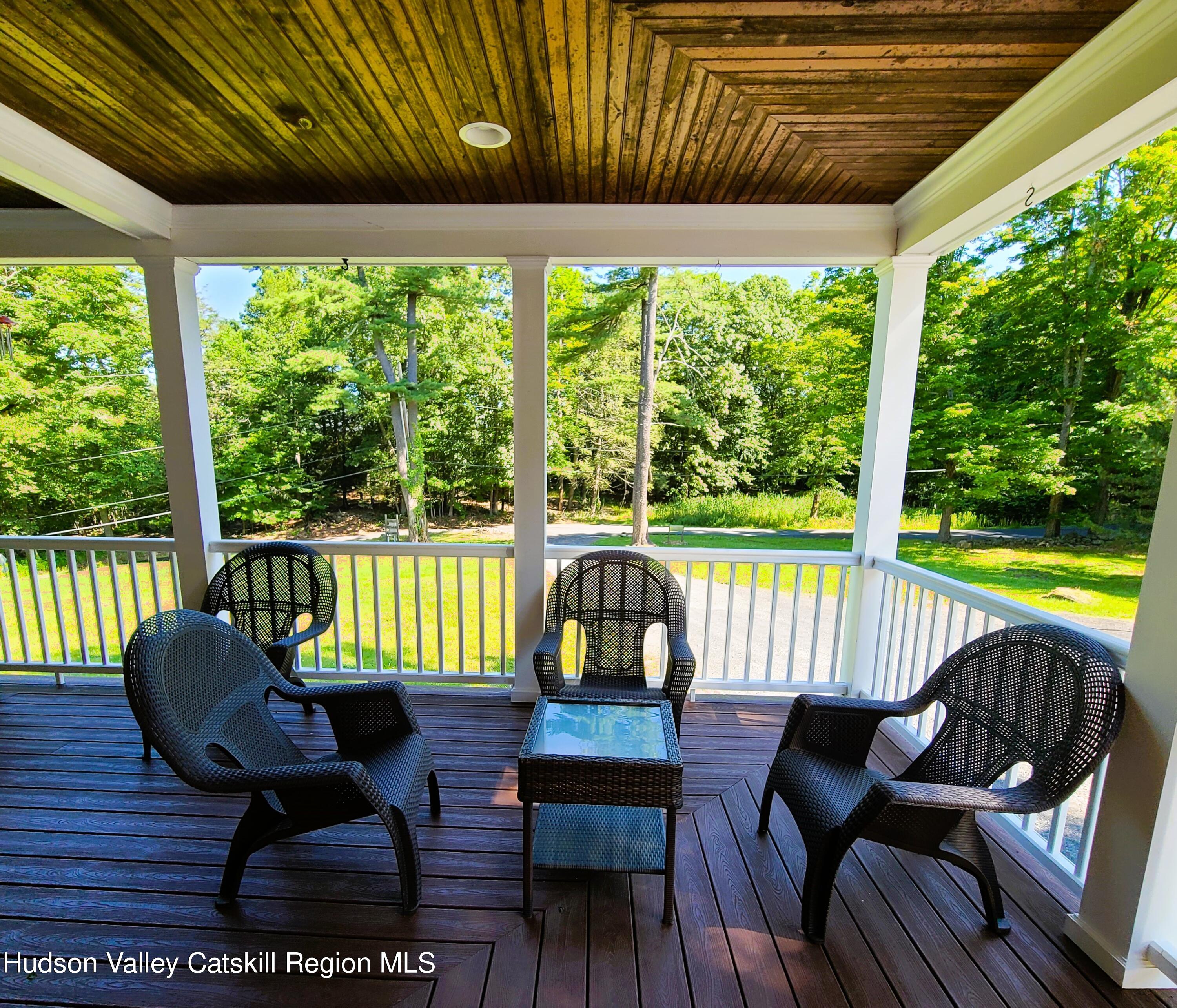 103 Carney Road Ulster Park, NY 12487 - Photo 5 of 89 a view of a chairs and table in patio next to a yard