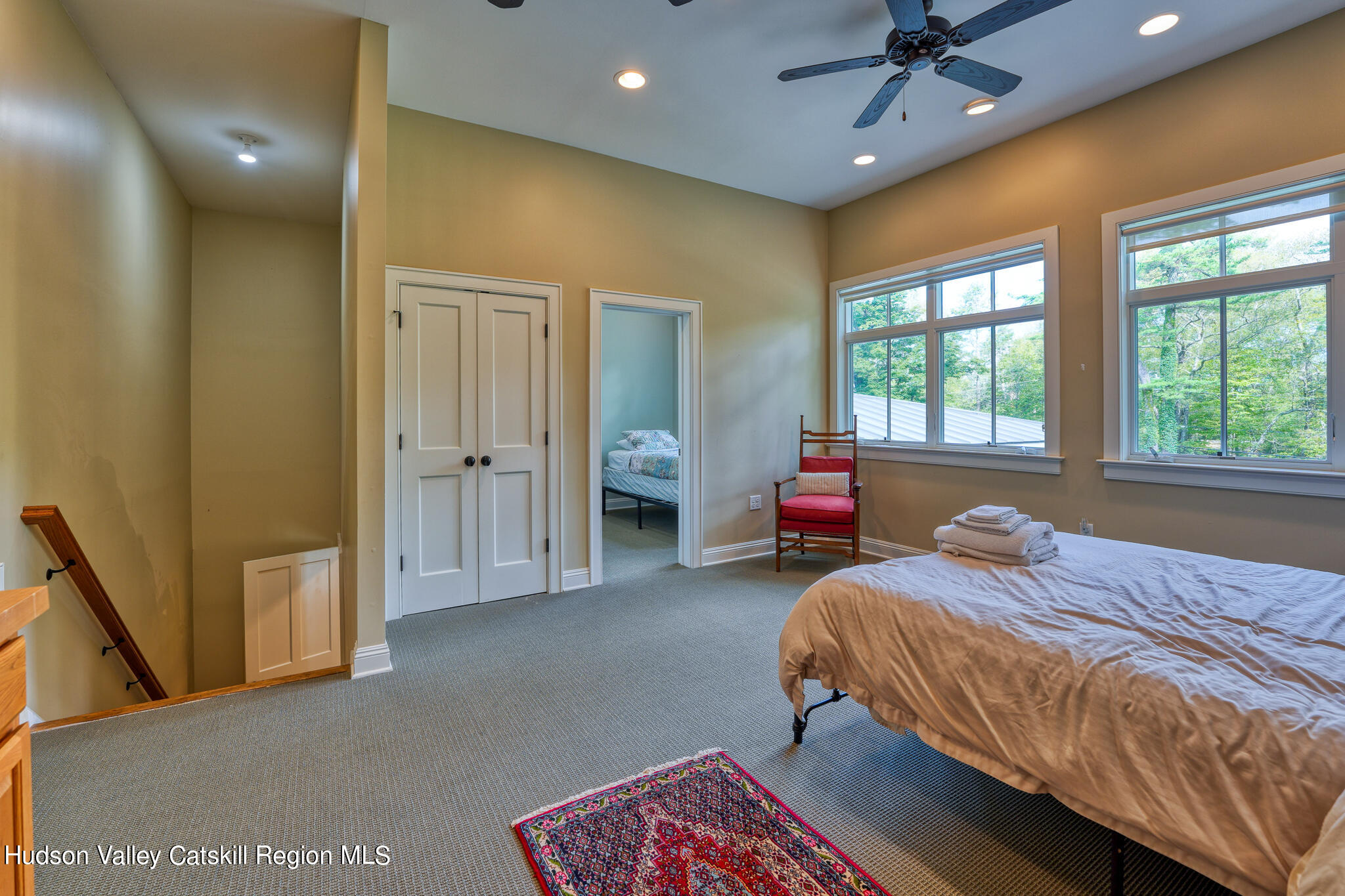 103 Carney Road Ulster Park, NY 12487 - Photo 53 of 89 a bedroom with a bed and a chandelier