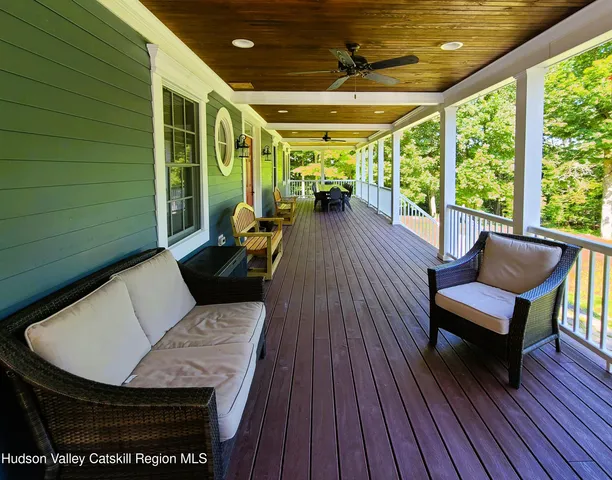 a view of a wooden deck with a table and chairs