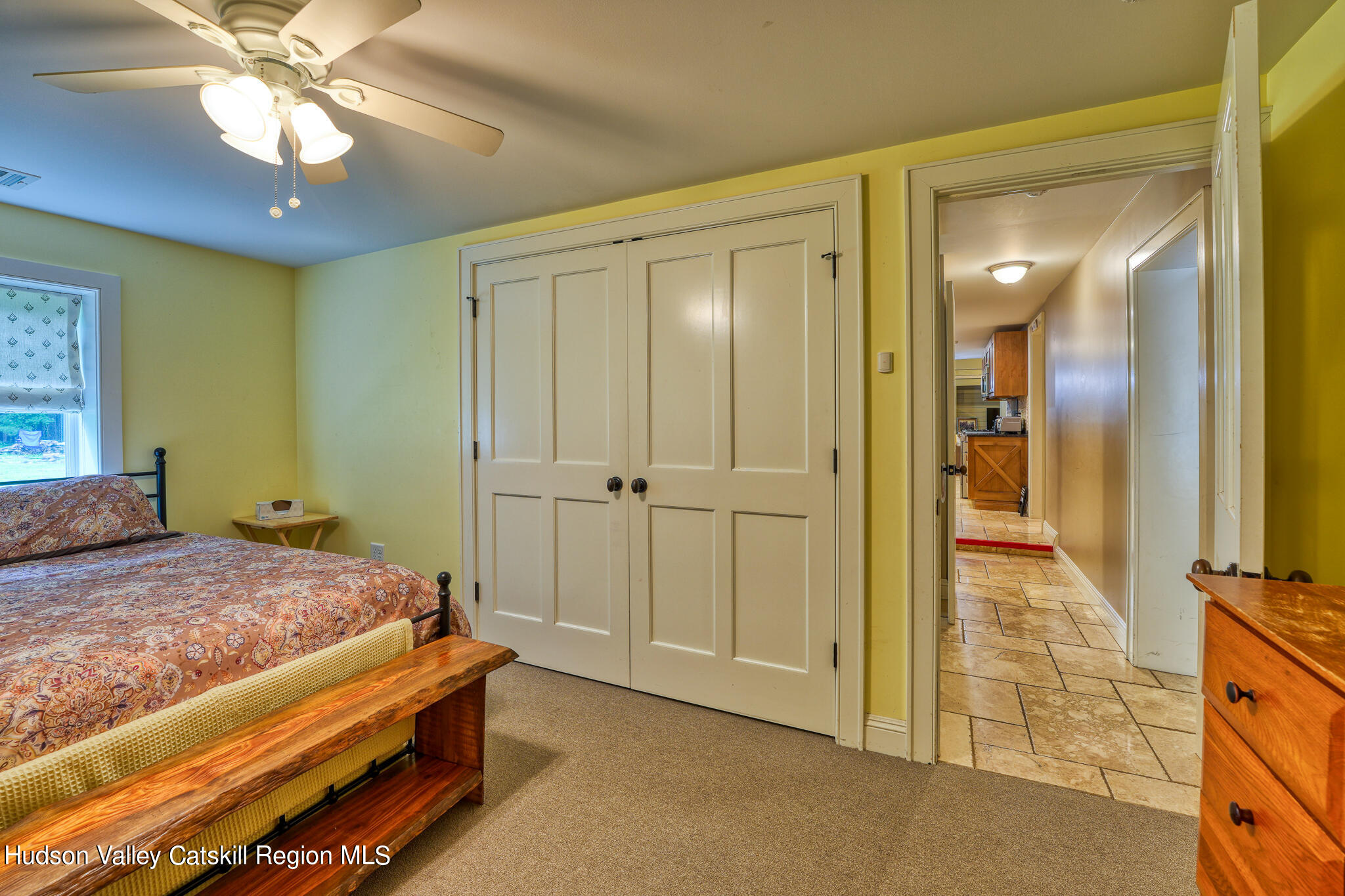 103 Carney Road Ulster Park, NY 12487 - Photo 62 of 89 a bedroom with a bed and a chandelier