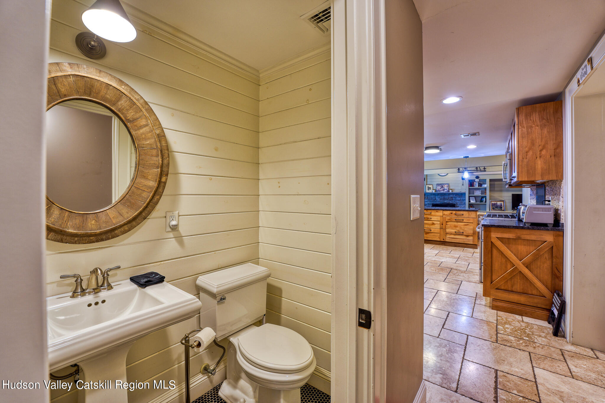 103 Carney Road Ulster Park, NY 12487 - Photo 65 of 89 a bathroom with a sink a toilet and a mirror