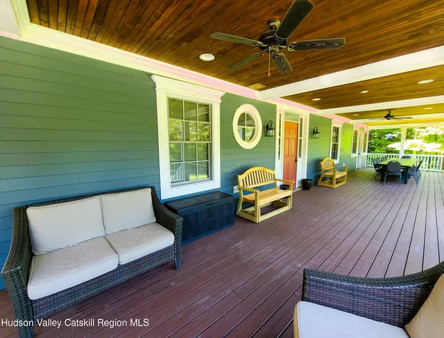 a view of a house with a yard and sitting area