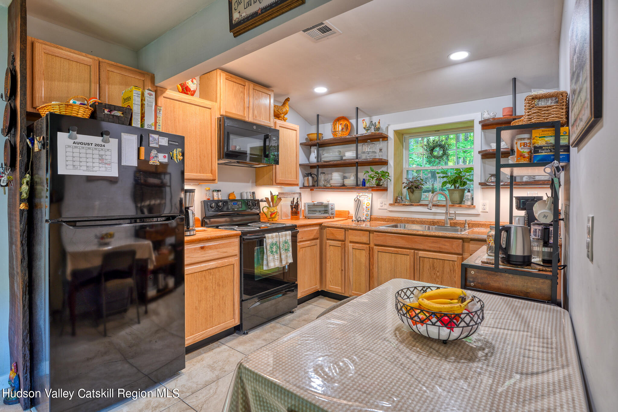 103 Carney Road Ulster Park, NY 12487 - Photo 77 of 89 a kitchen with stainless steel appliances granite countertop a refrigerator sink and stove