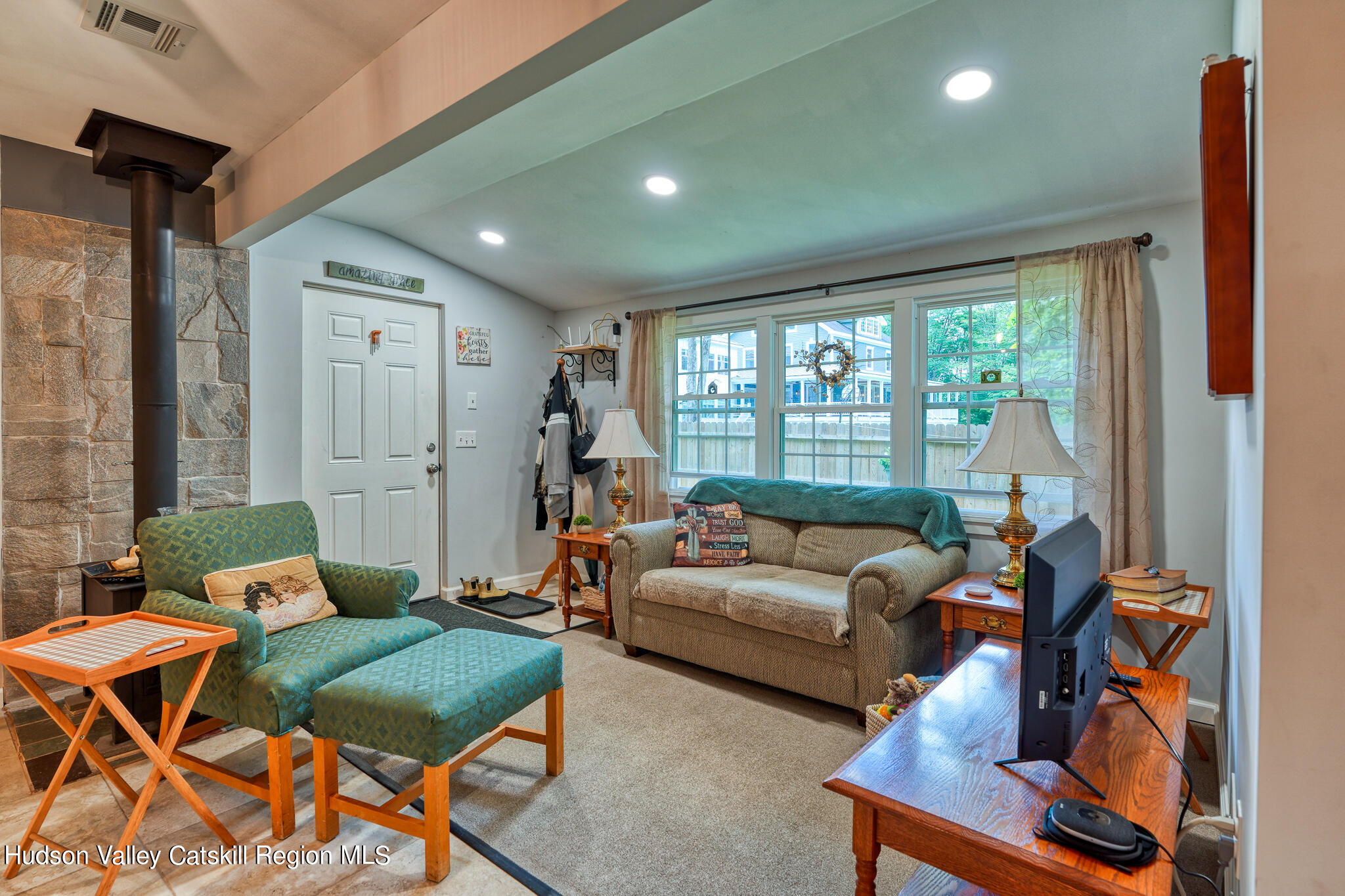 103 Carney Road Ulster Park, NY 12487 - Photo 79 of 89 a living room with furniture and a floor to ceiling window