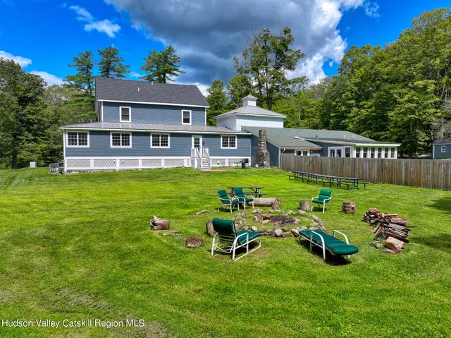 a kitchen with granite countertop a sink a counter top space stainless steel appliances and cabinets