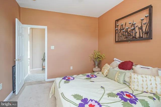 a bathroom with a toilet sink vanity and mirror