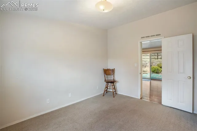 a view of room with window and bathroom