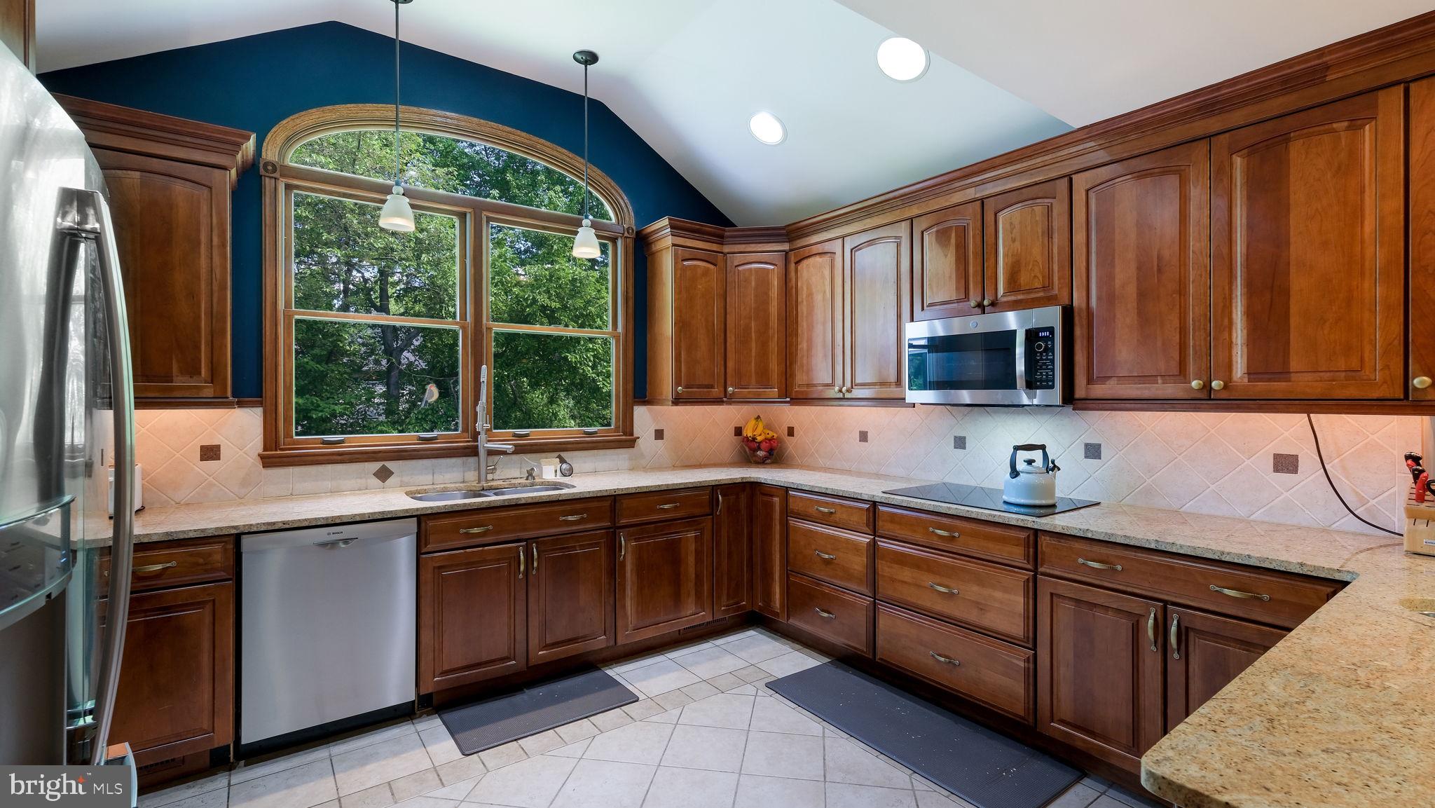 1270 Oxford Valley Road Yardley, PA 19067 - Photo 12 of 39 a kitchen with a sink window and cabinets