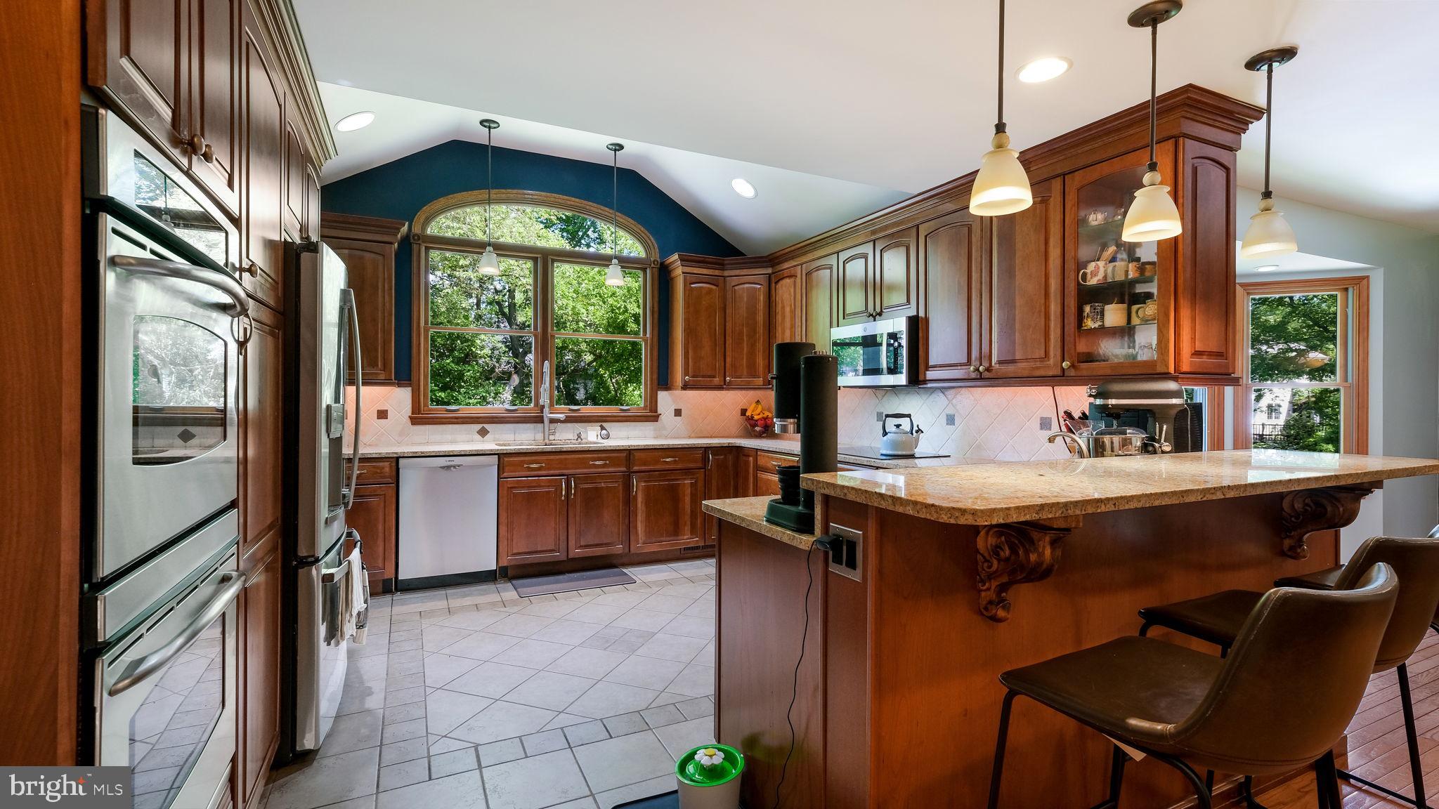 1270 Oxford Valley Road Yardley, PA 19067 - Photo 16 of 39 a kitchen with a stove a sink and a refrigerator