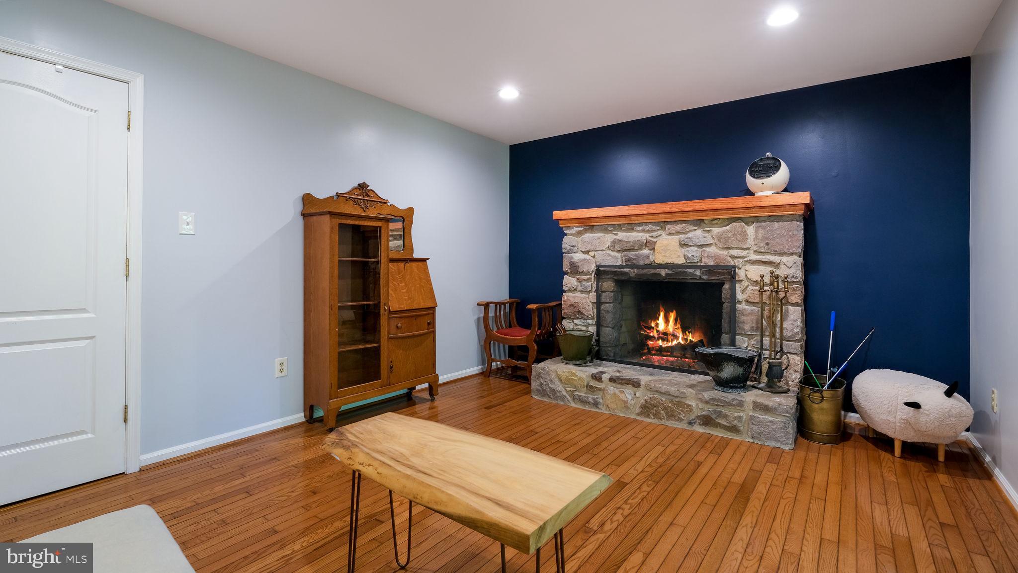 1270 Oxford Valley Road Yardley, PA 19067 - Photo 17 of 39 a living room with furniture and a fireplace