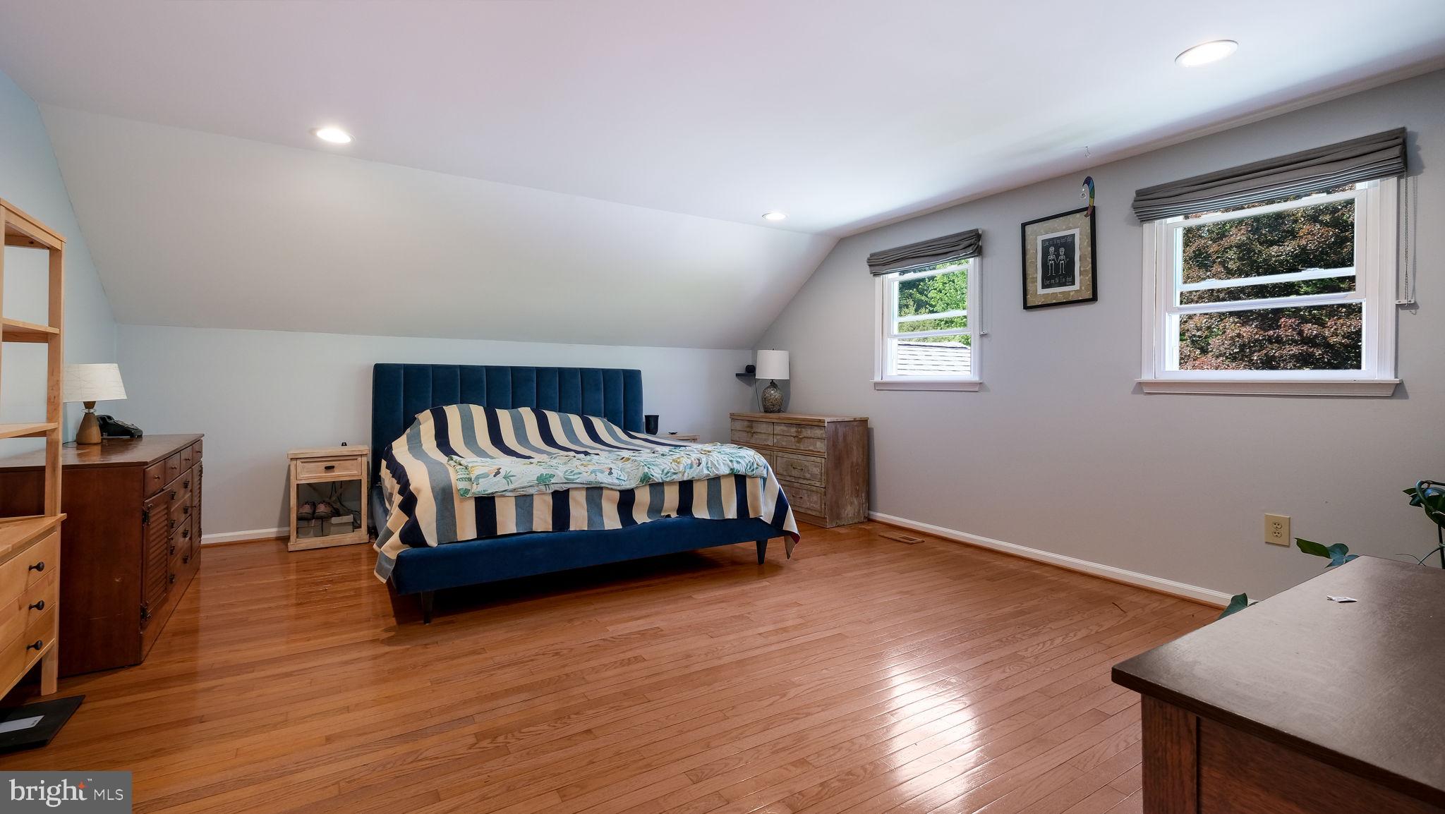 1270 Oxford Valley Road Yardley, PA 19067 - Photo 24 of 39 a bedroom with a bed and wooden floor