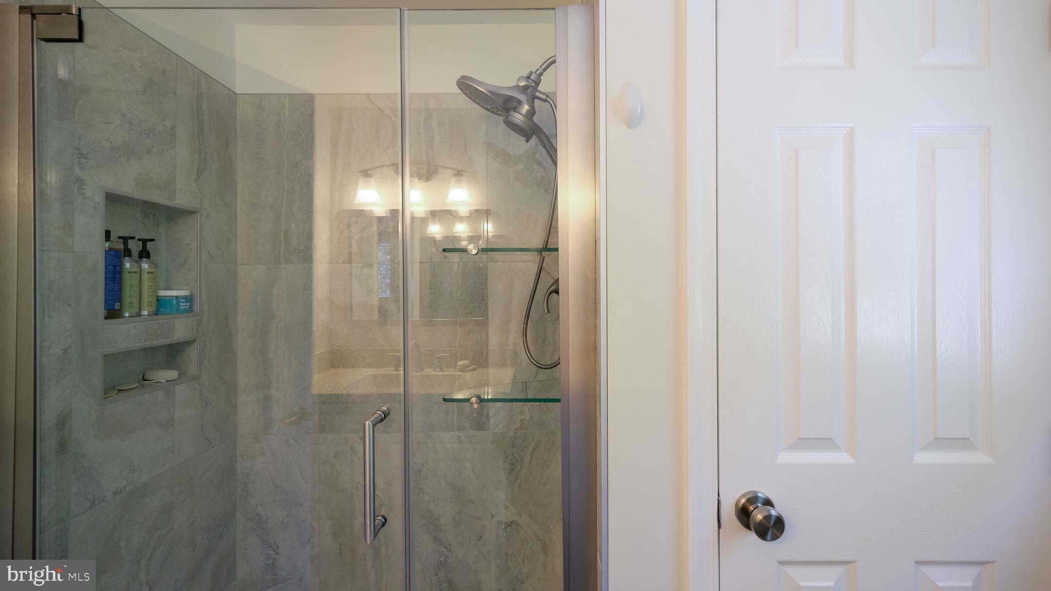 1270 Oxford Valley Road Yardley, PA 19067 - Photo 25 of 39 a bathroom with a glass shower door