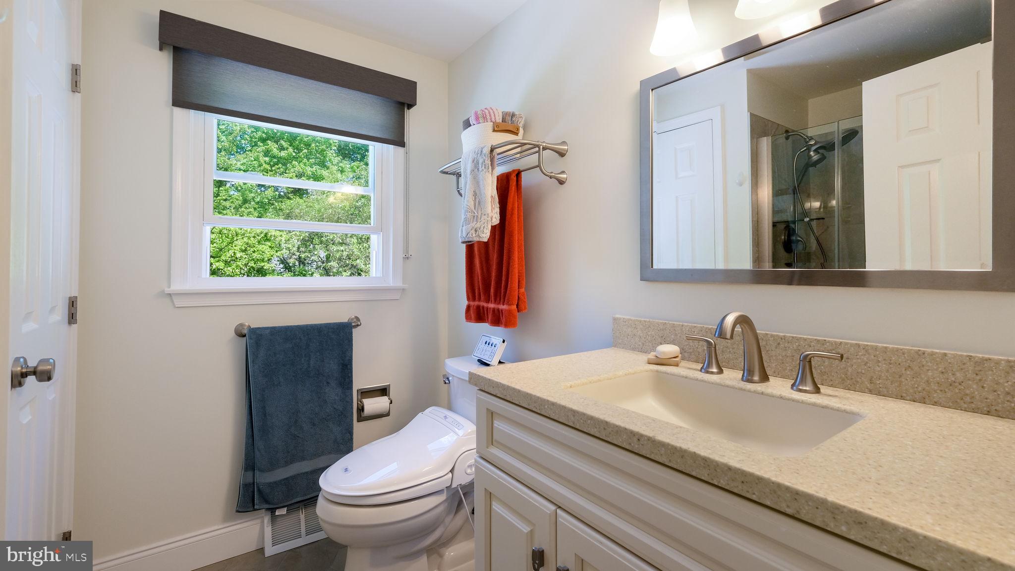 1270 Oxford Valley Road Yardley, PA 19067 - Photo 26 of 39 a bathroom with a sink a toilet and a mirror