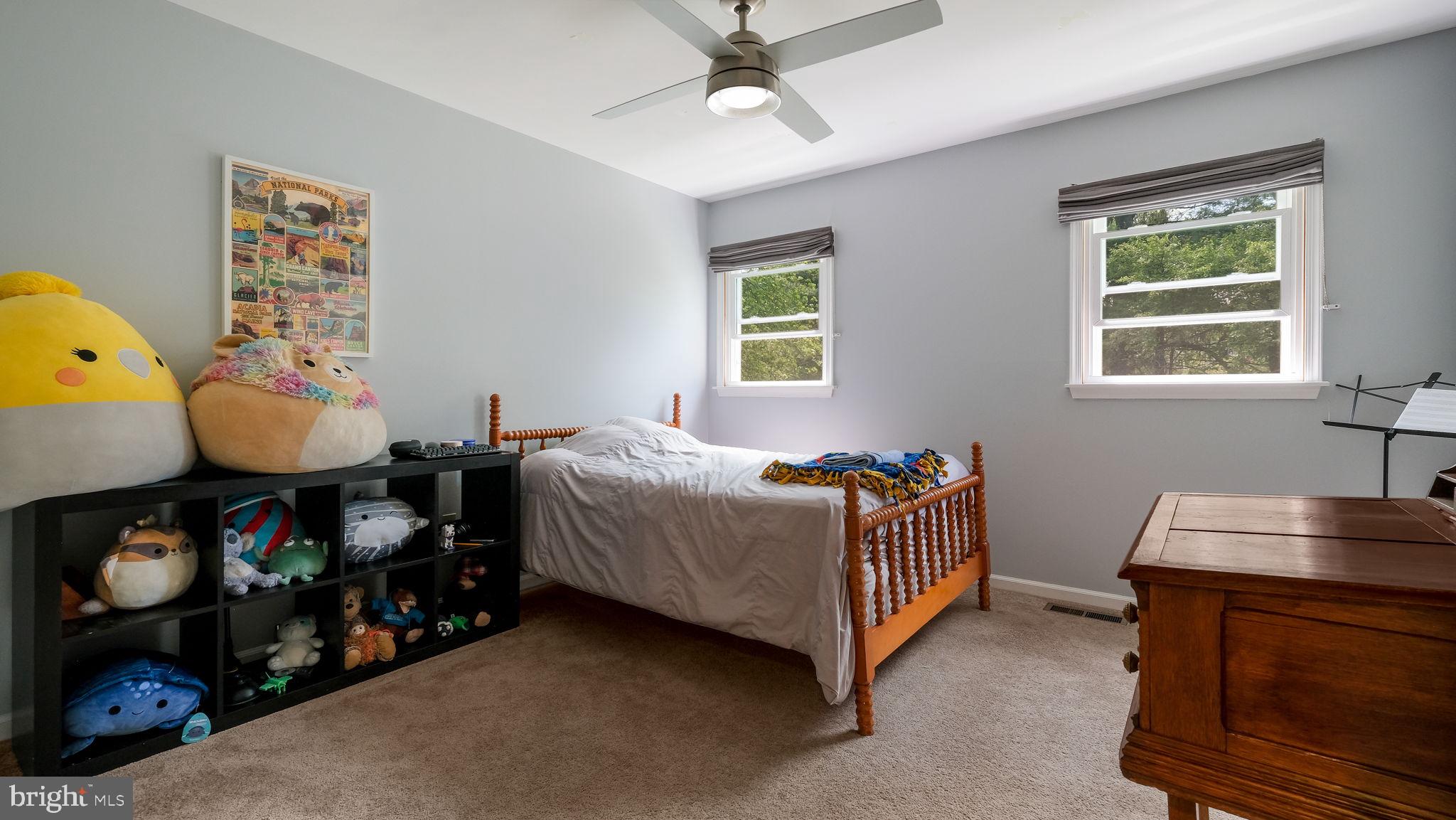 1270 Oxford Valley Road Yardley, PA 19067 - Photo 27 of 39 a bedroom with a bed and a chandelier