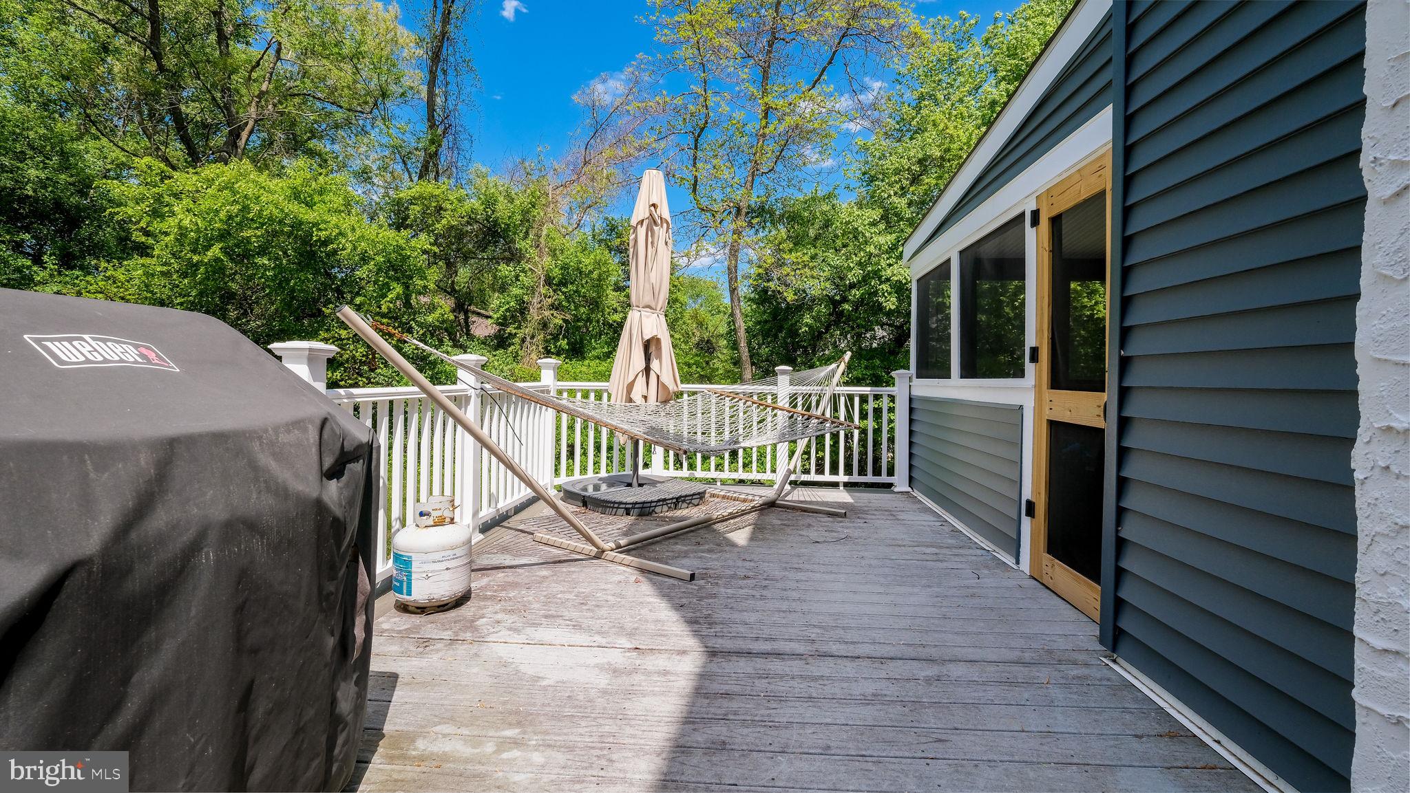 1270 Oxford Valley Road Yardley, PA 19067 - Photo 32 of 39 a view of a deck with two plants and wooden fence