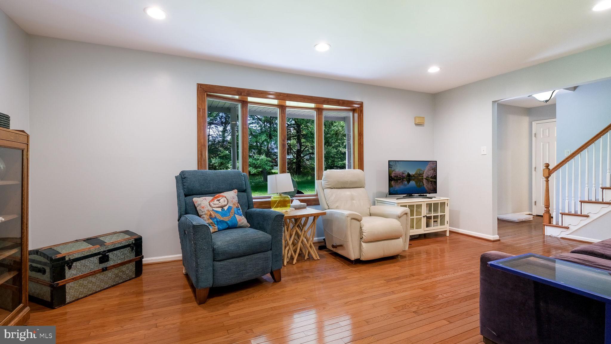 1270 Oxford Valley Road Yardley, PA 19067 - Photo 8 of 39 a living room with furniture flat screen tv and a large window